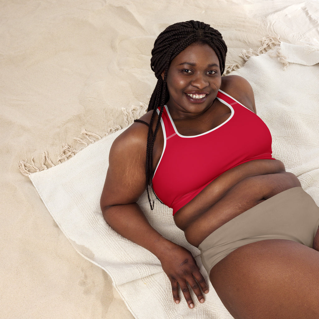 A woman wearing a women’s crimson red padded sports bra with white trim made of buttery soft quick-dry fabric