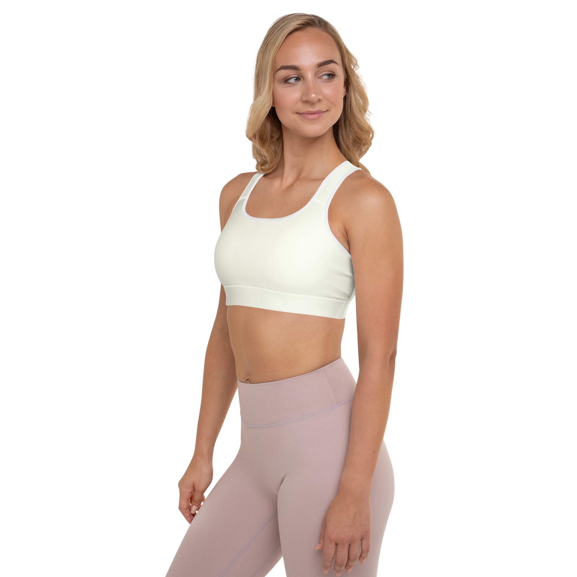 Cream padded sports bra with wide straps and supportive band in buttery soft quick dry fabric for women