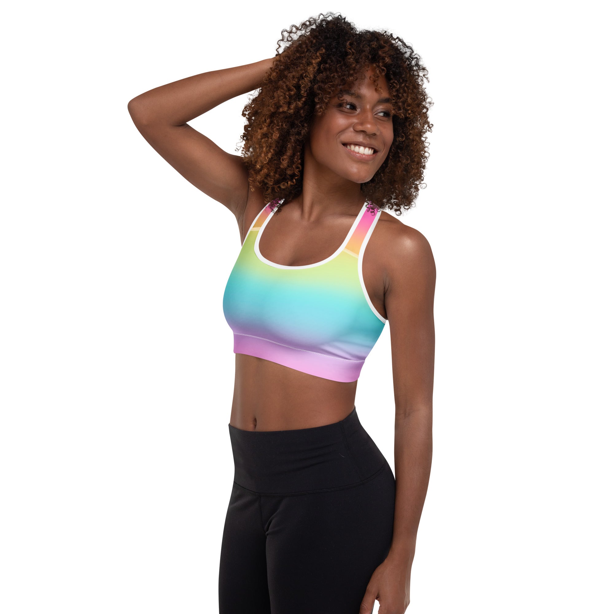 Women’s bright rainbow padded sports bra with white trim and adjustable straps made of buttery soft quick-dry fabric