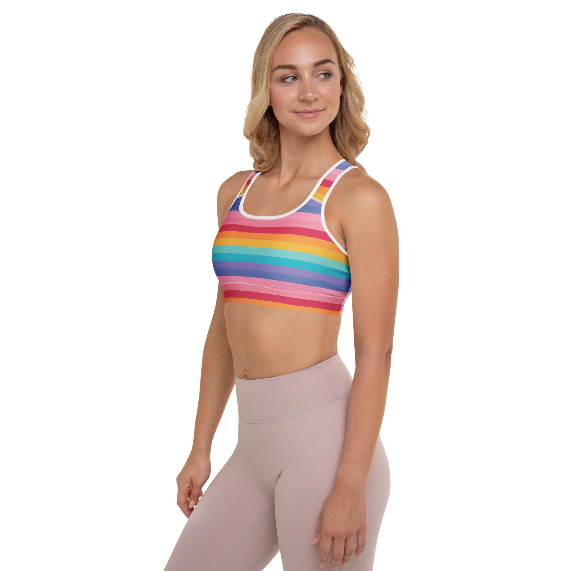 Women’s padded sports bra with rainbow stripes and white trim made of buttery soft, supportive, quick-dry fabric