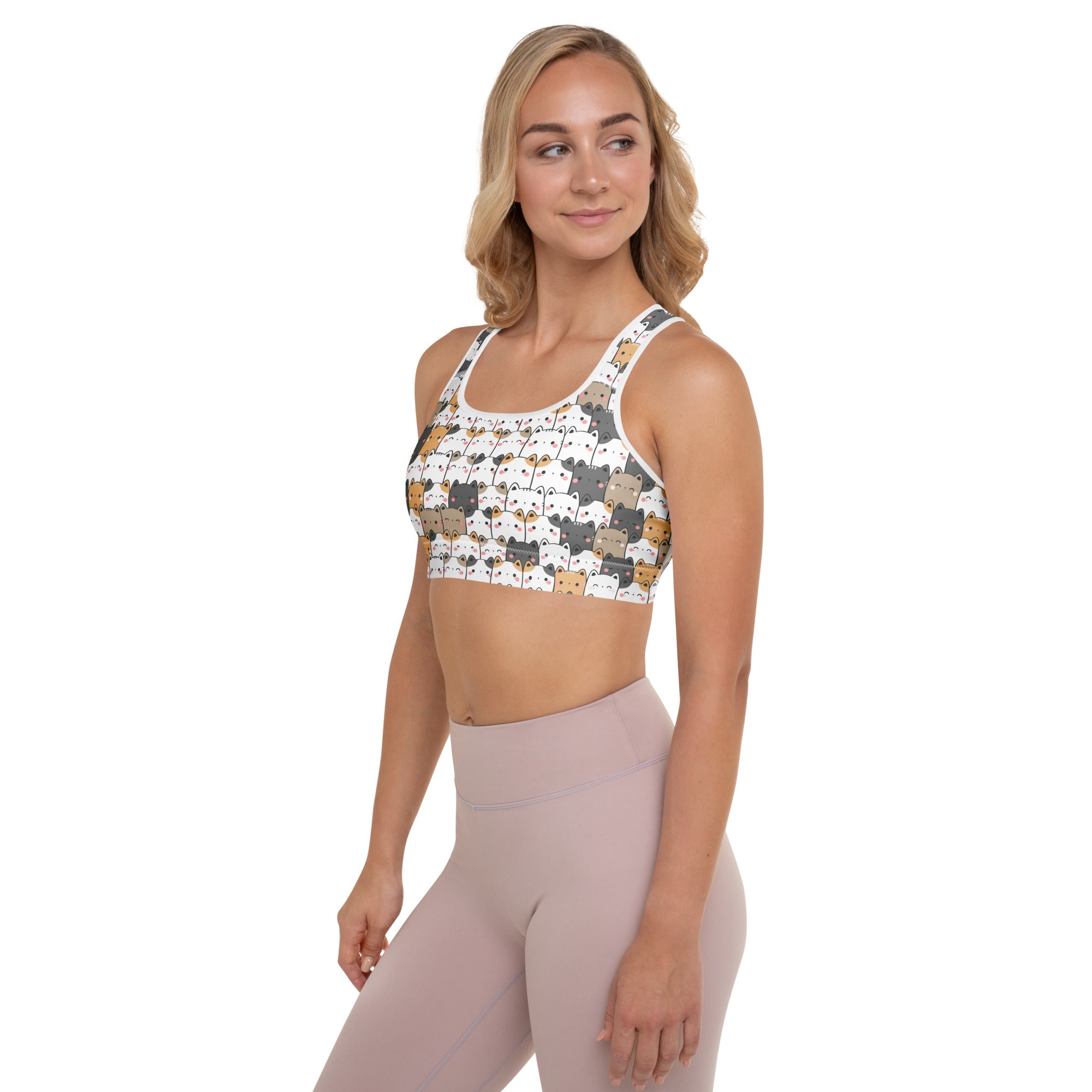 White women’s kawaii cat padded sports bra with colorful cartoon cats, buttery soft, supportive, and quick dry material