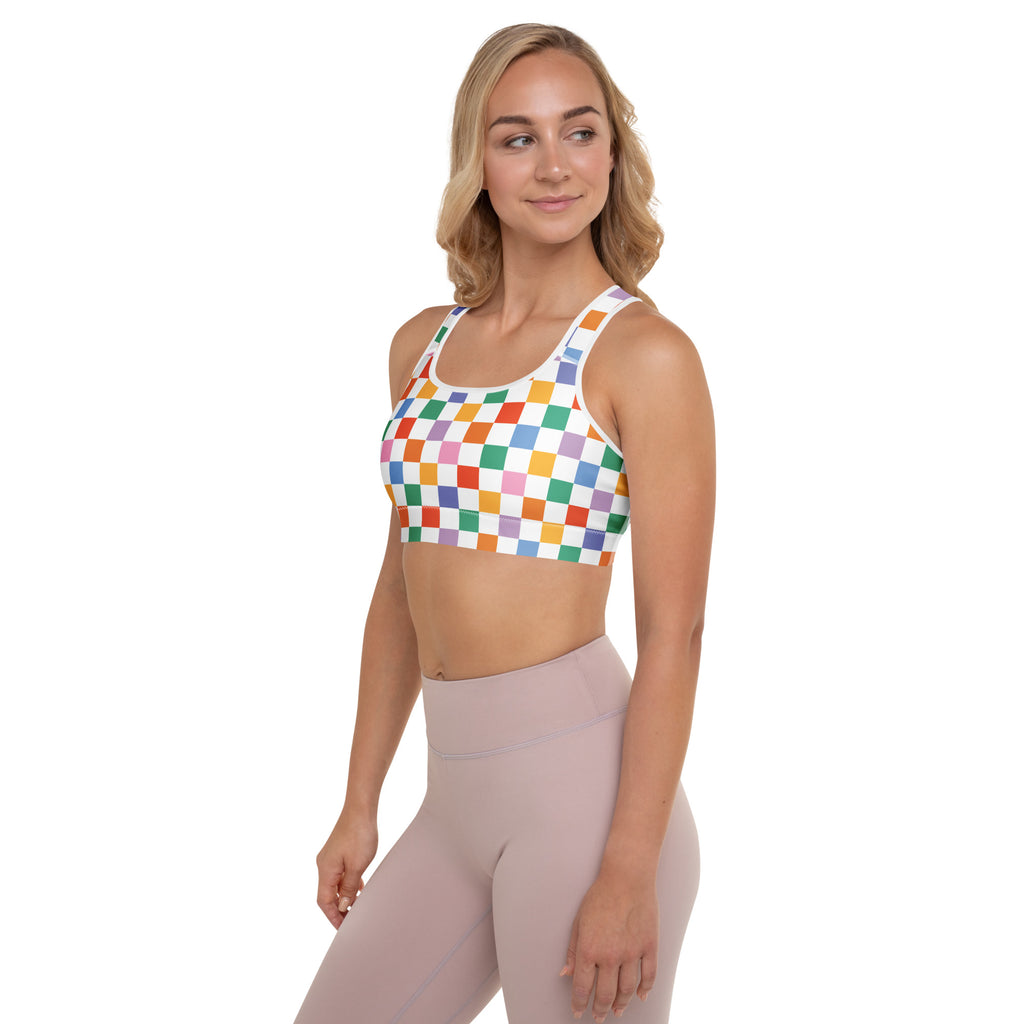Women’s colorful checkerboard padded sports bra in rainbow with white trim, buttery soft, supportive, and quick-dry