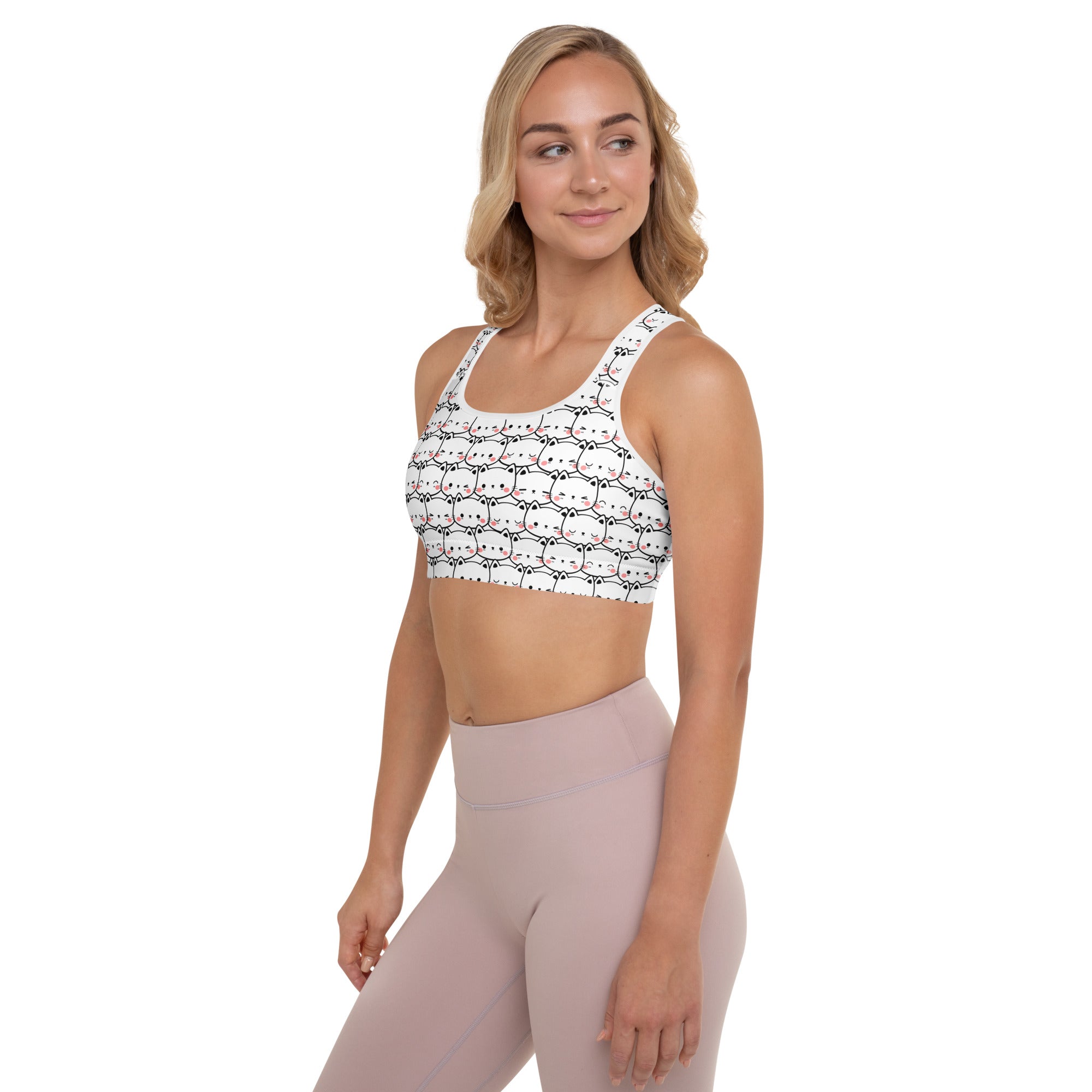 White padded sports bra with black and pink cartoon cat print, buttery soft, supportive, and quick-dry for women