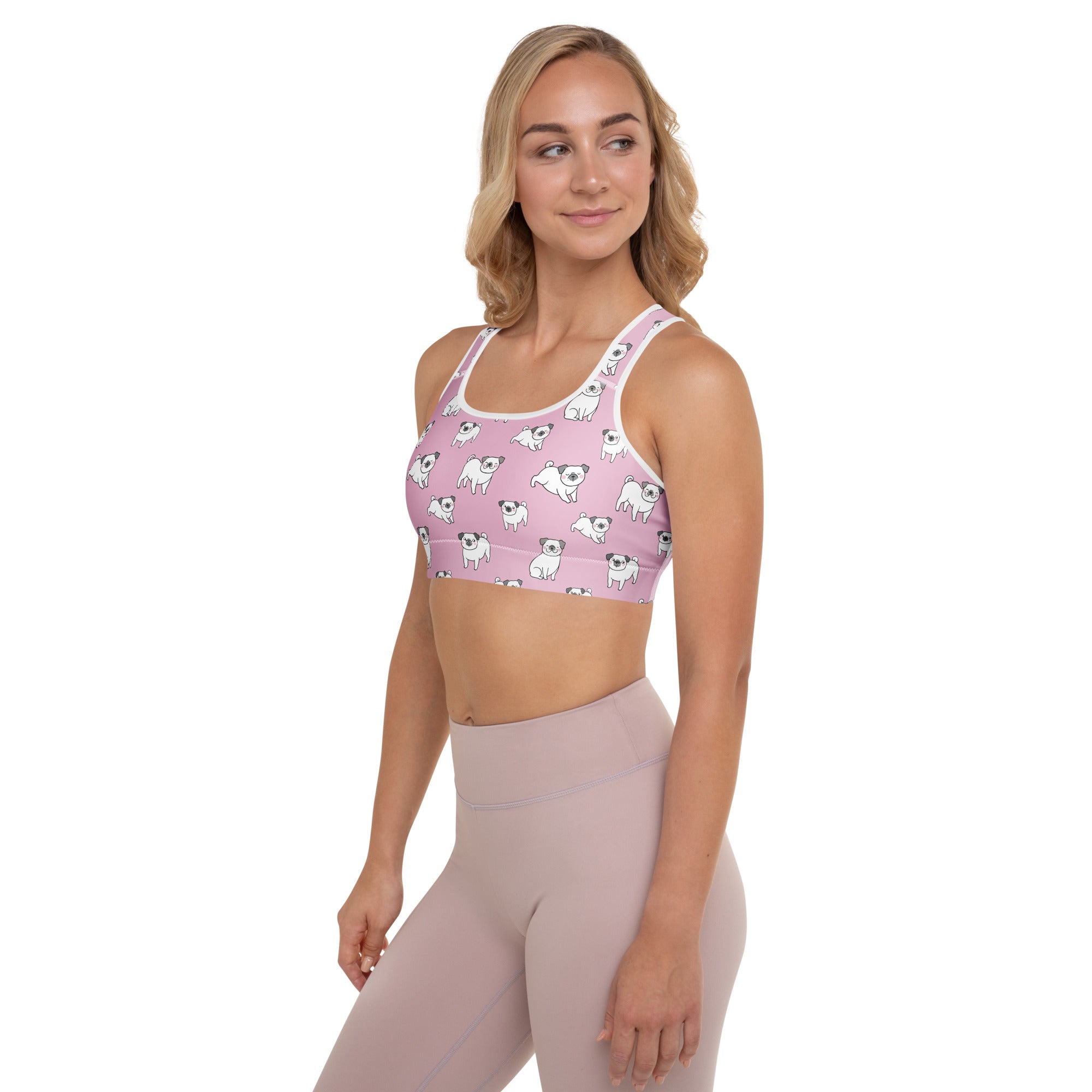 Women’s pink pug padded sports bra with white trim and repeating pug pattern, buttery soft, supportive, and quick-dry