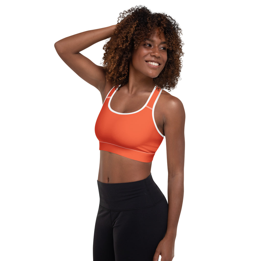 Women’s orange padded sports bra with white trim offers buttery soft, supportive, and quick-dry performance