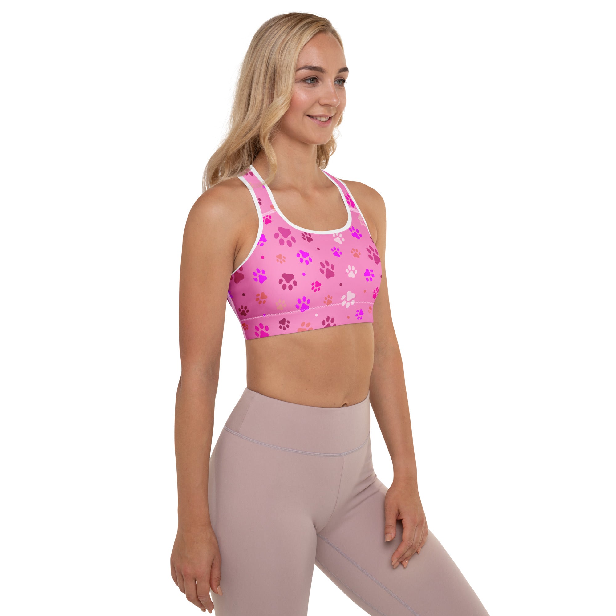 Women’s pink paw print padded sports bra with white trim buttery soft supportive quick dry material