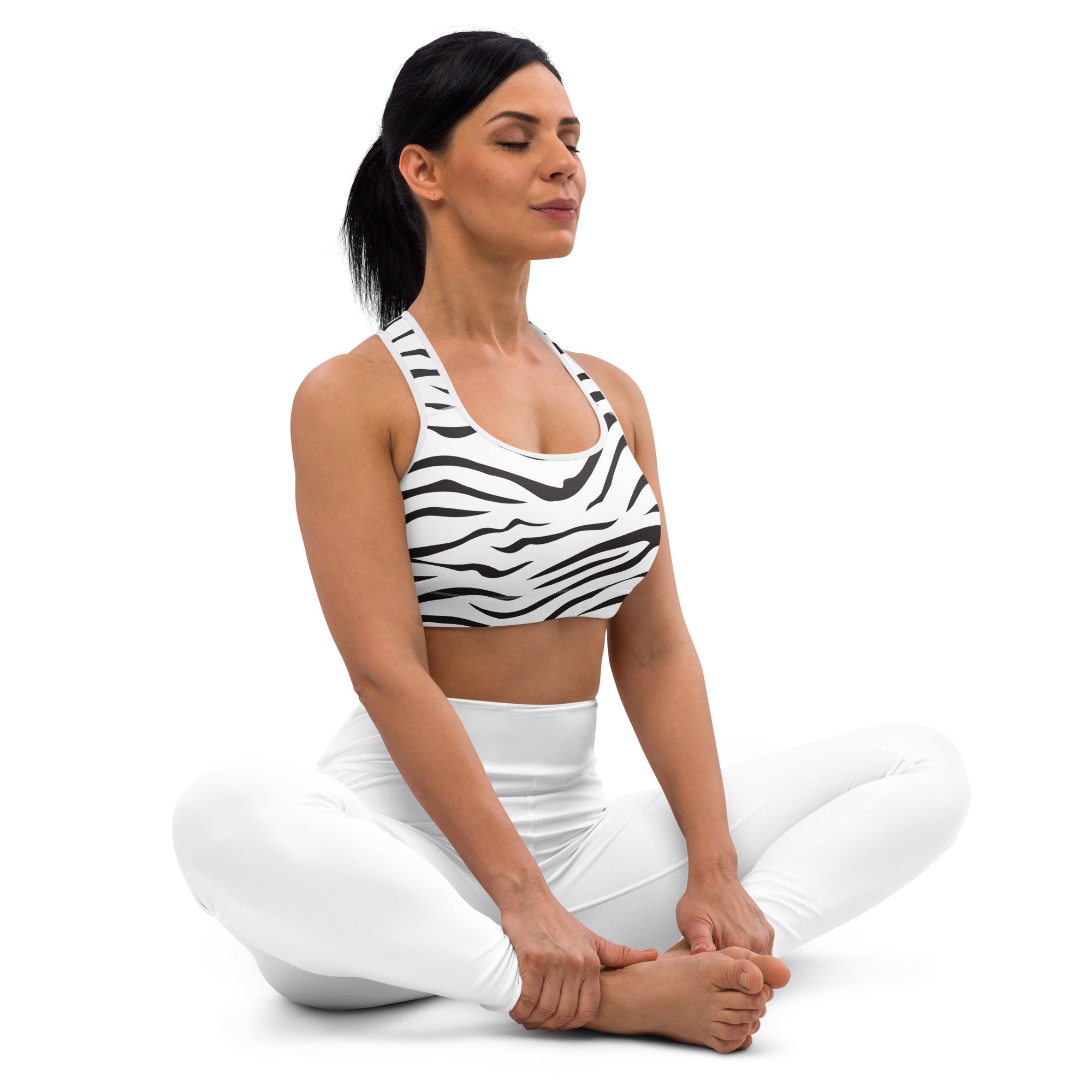 Women’s zebra print padded sports bra with black and white stripes, racerback design, buttery soft and quick-dry fabric