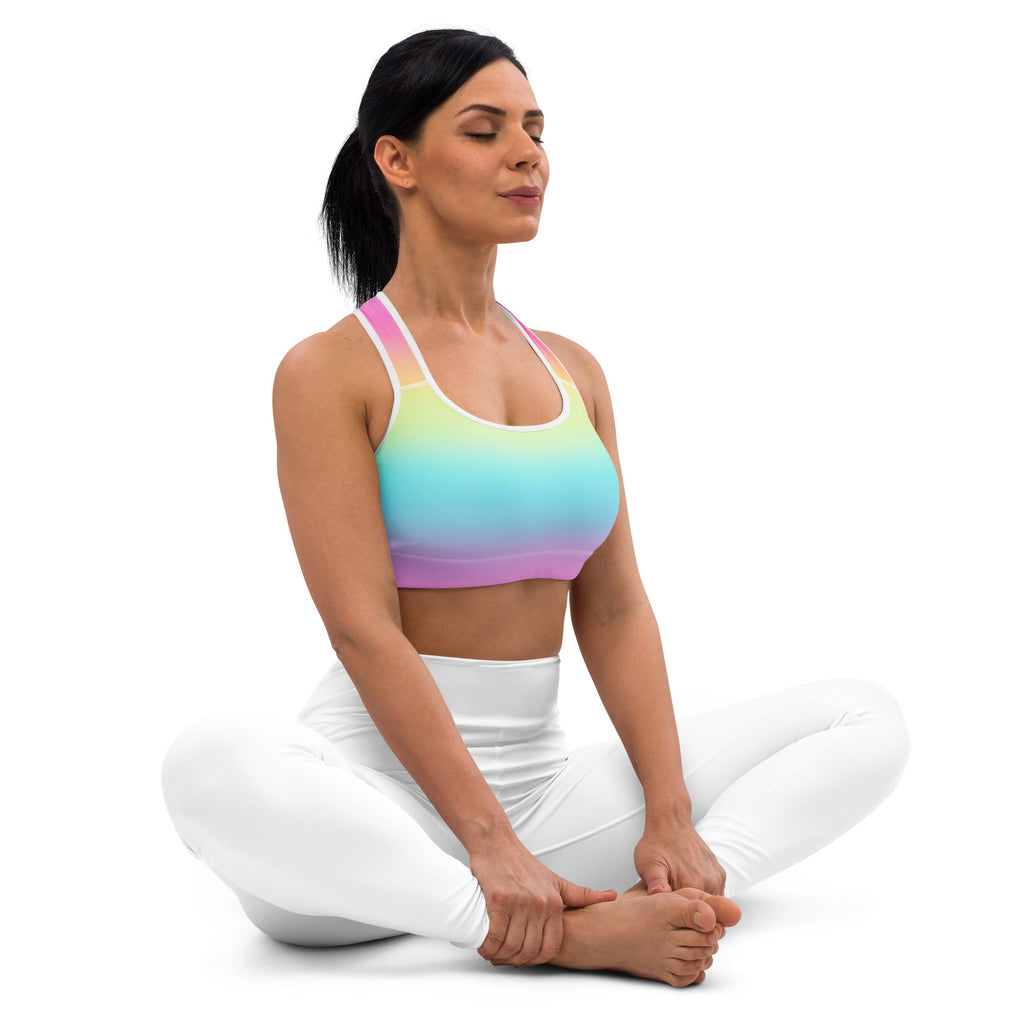 Women’s bright rainbow padded sports bra with white straps and matching leggings made of quick-dry buttery soft fabric