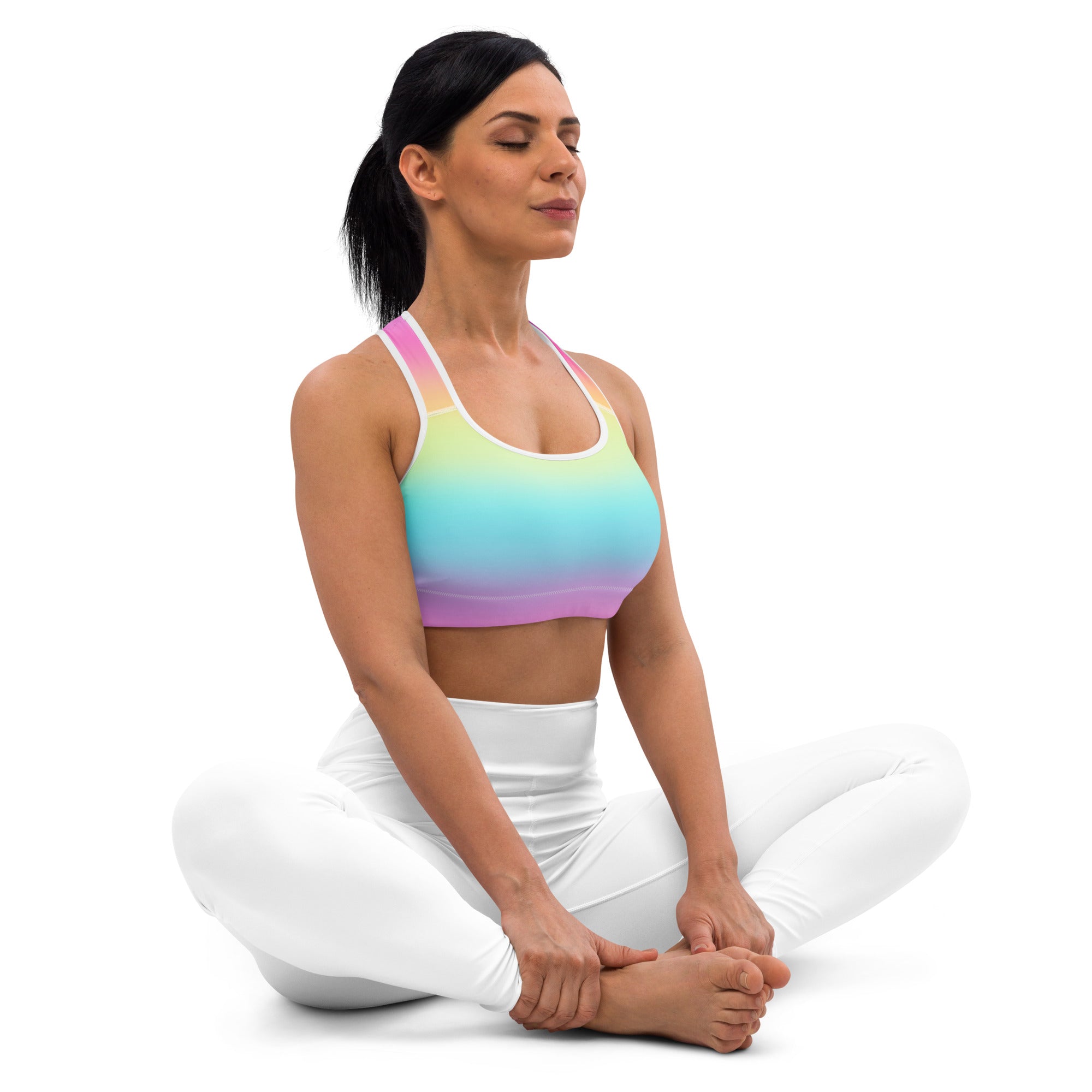 Women’s bright rainbow padded sports bra with white straps and matching leggings made of quick-dry buttery soft fabric