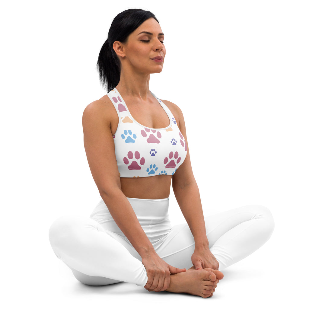 White women’s padded sports bra with colorful paw print pattern buttery soft supportive and quick-dry fabric