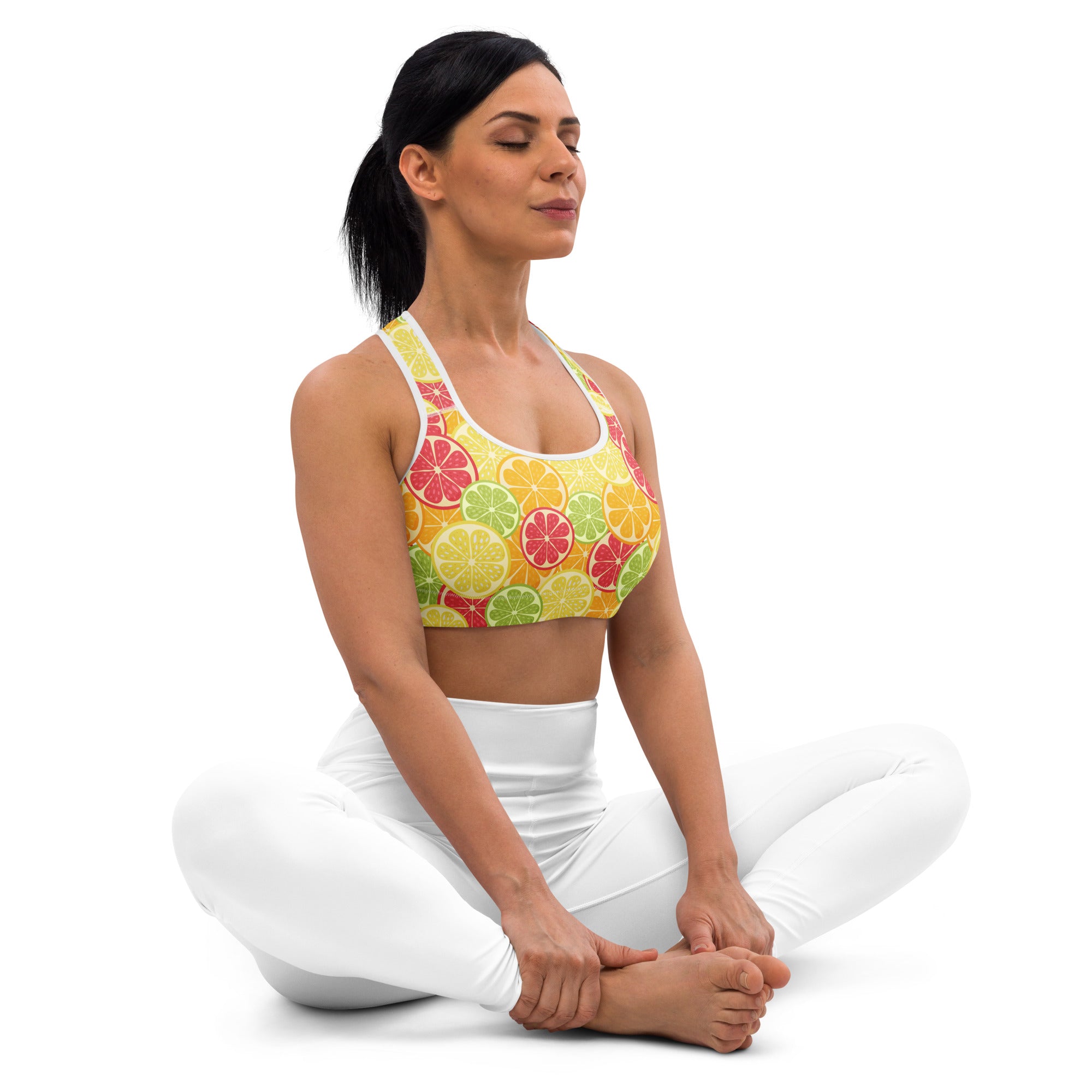 Women’s yellow sports bra with citrus slice pattern in red green and orange buttery soft padded quick-dry design