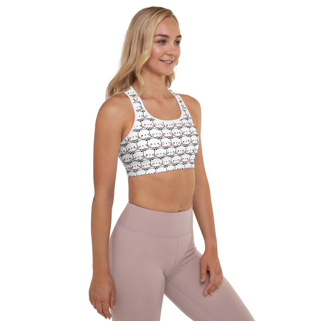 White women’s cat print padded sports bra with black and pink cartoon cats, buttery soft, supportive, and quick-dry
