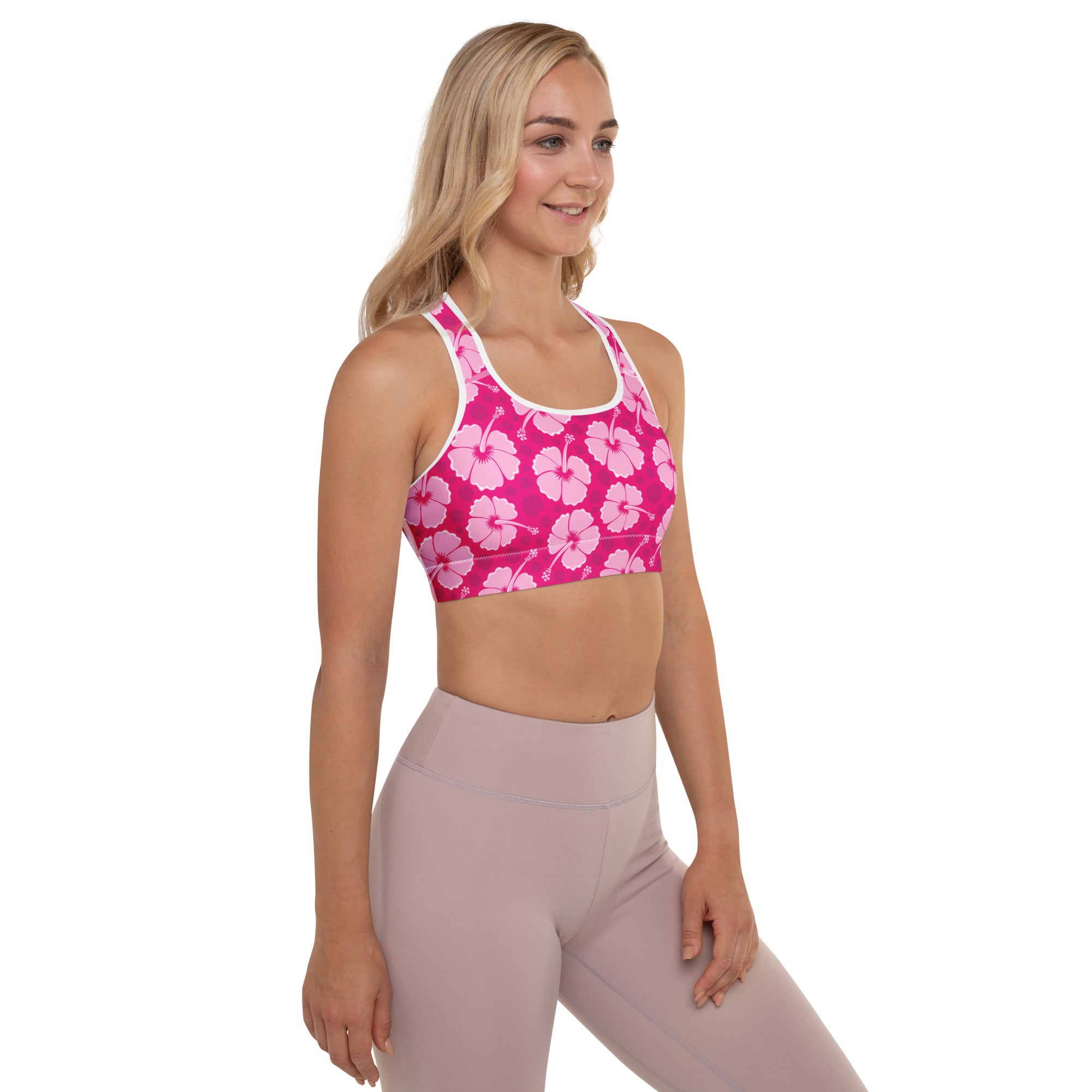 Women’s pink hibiscus floral padded sports bra with white trim buttery soft supportive and quick dry fabric
