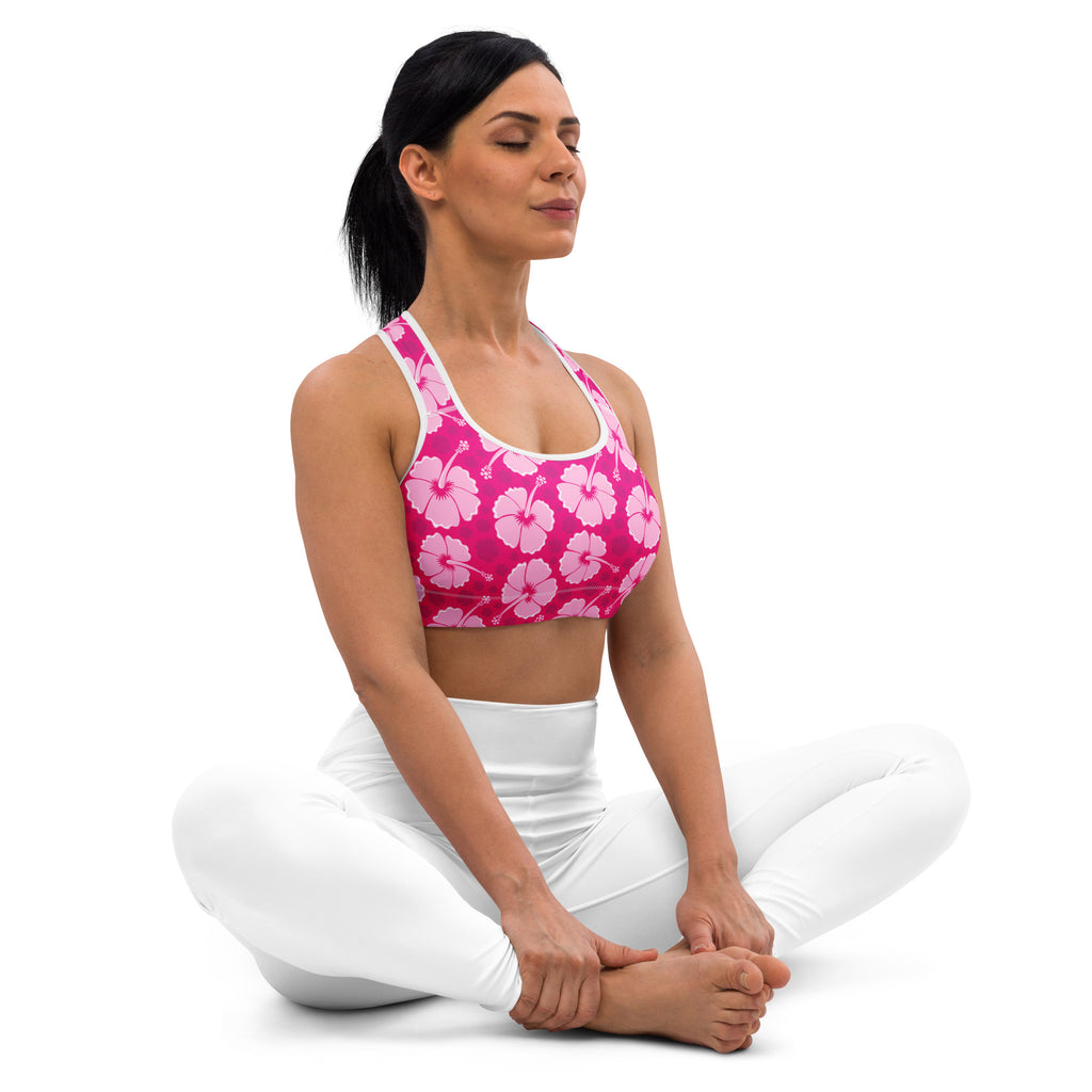 Women’s pink hibiscus floral padded sports bra with white trim made from buttery soft quick-dry fabric for support