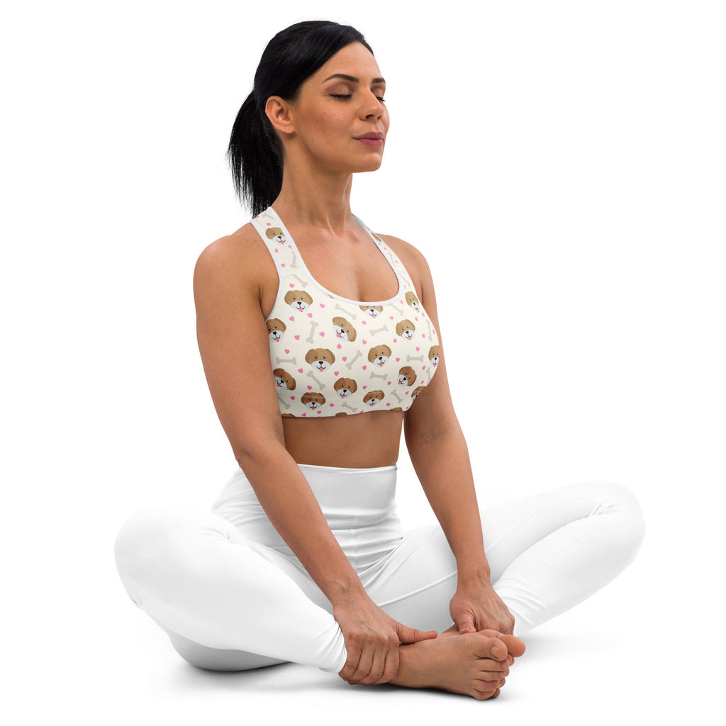White padded sports bra with brown beagle faces and pink hearts pattern designed for support and quick-dry comfort