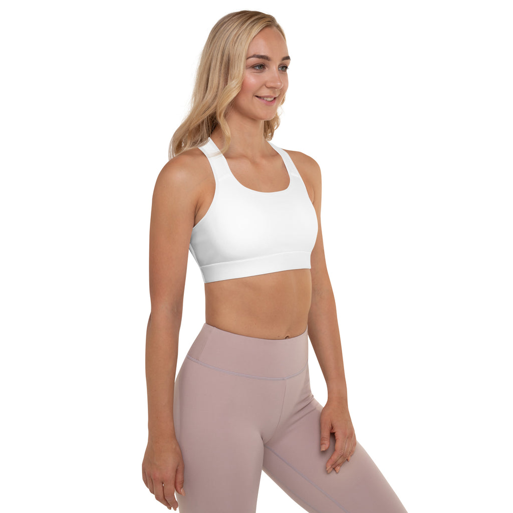 Women’s white padded sports bra with buttery soft fabric, supportive seamless design, and wide shoulder straps