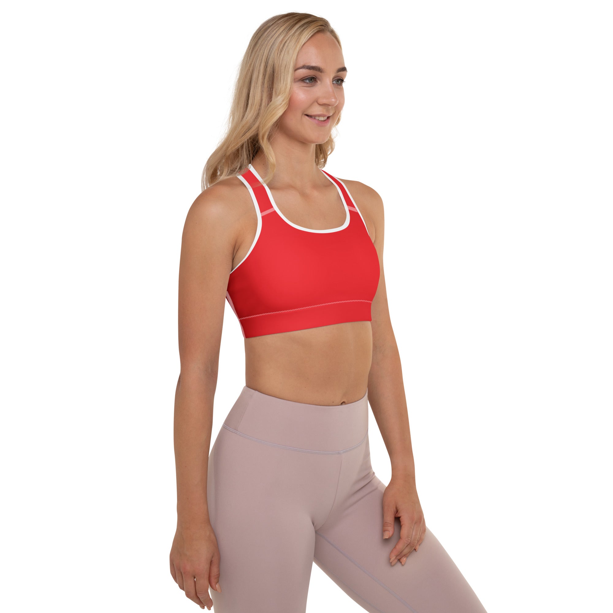 Women’s red padded sports bra with white trim racerback design buttery soft supportive and quick-dry material