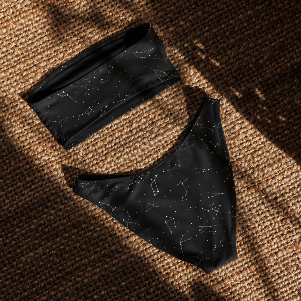 Women’s black bikini set with white constellation print made from recycled quick drying fabric with upf 50 plus
