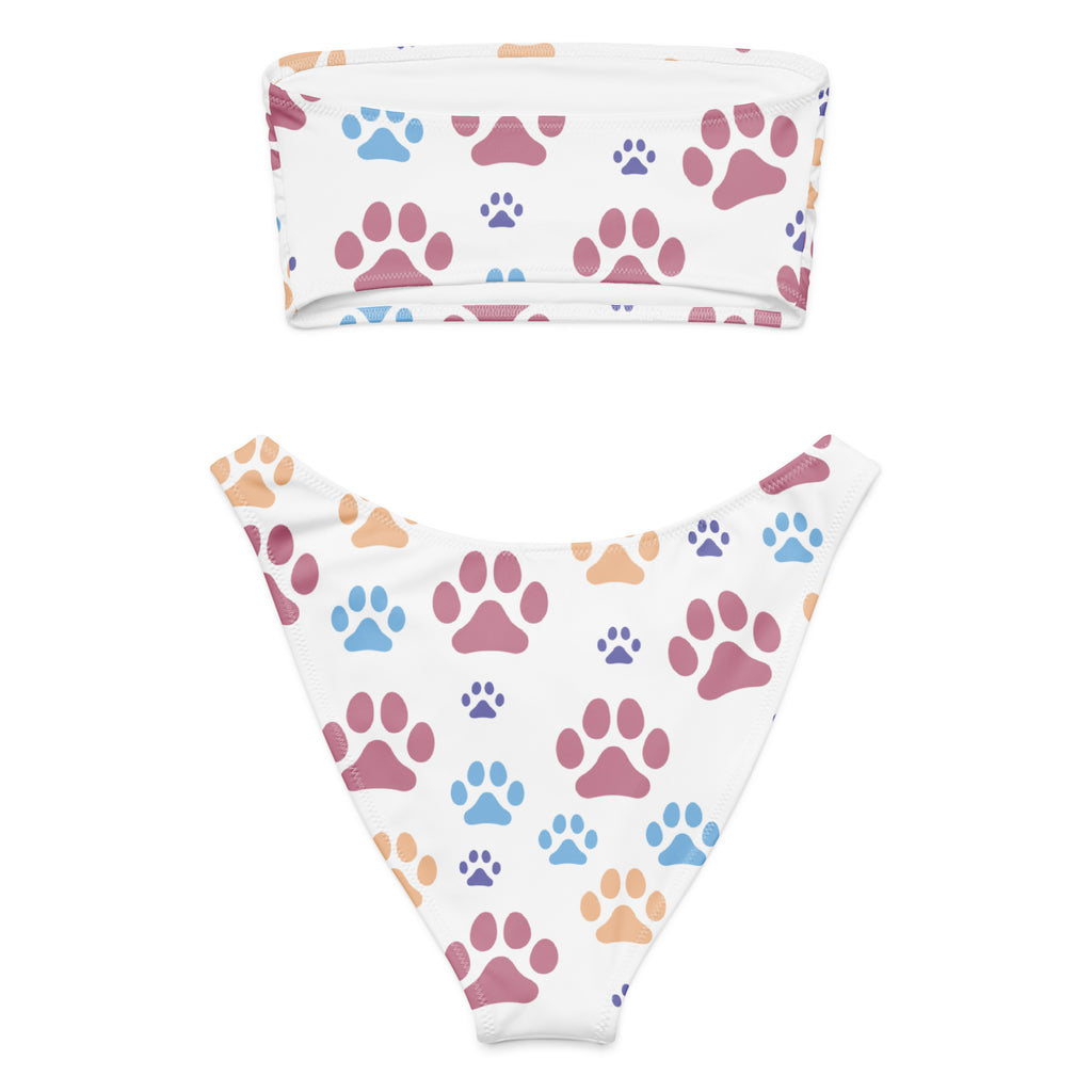 White bikini set with bandeau top and high-waisted bottoms featuring colorful paw prints made of quick drying recycled fabric with upf 50+
