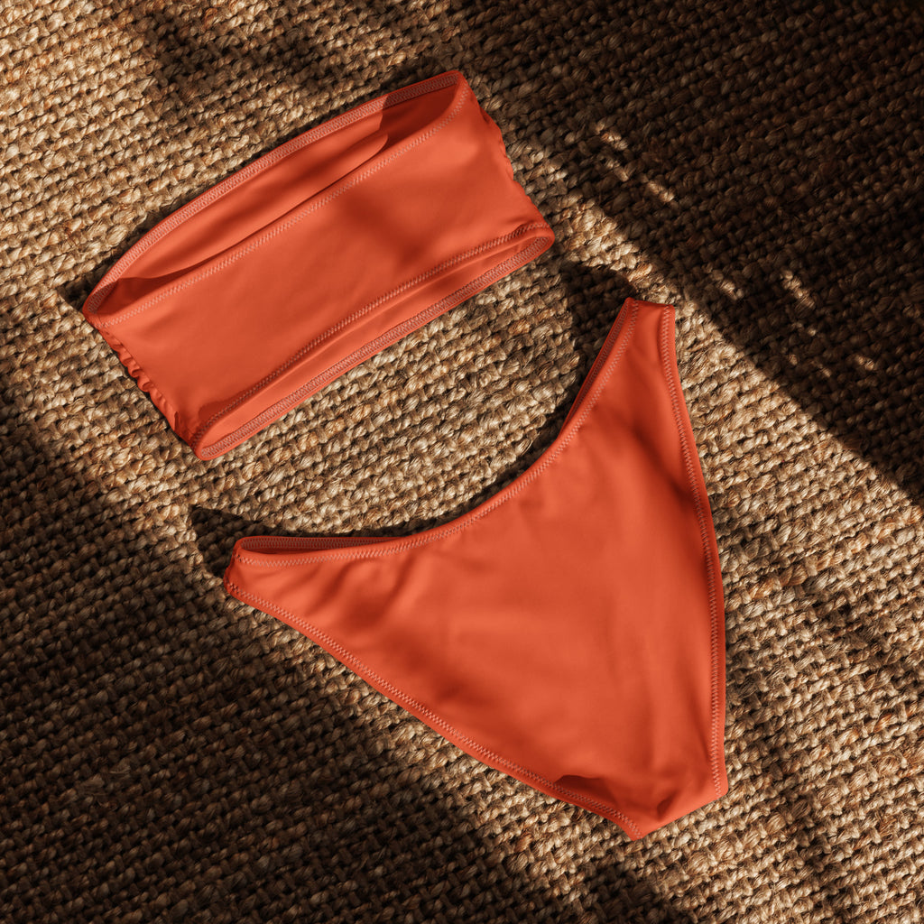 Women’s orange recycled bandeau bikini with minimalist design smooth stretch fabric quick drying and upf 50 plus protection