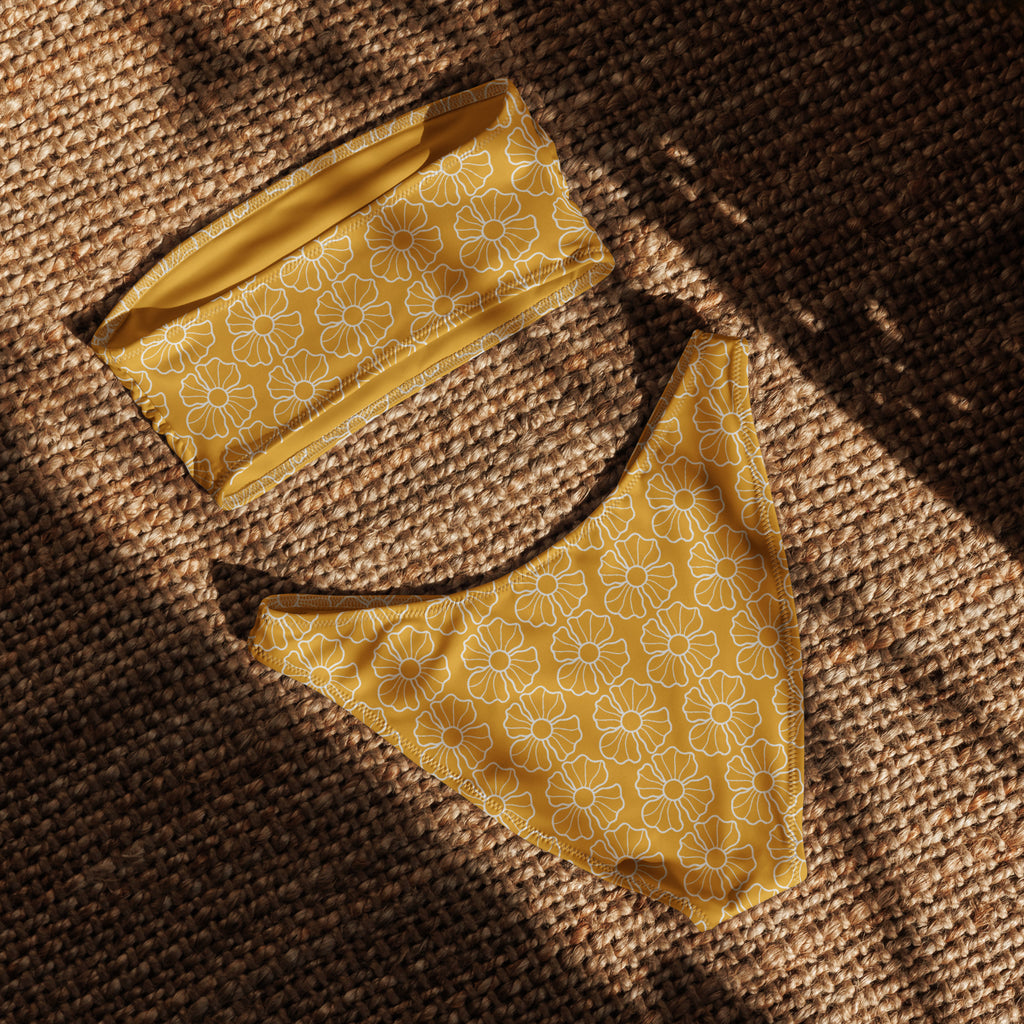 Women’s mustard yellow floral recycled bandeau bikini with white daisy pattern and quick drying upf 50 plus fabric