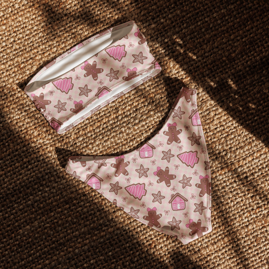 Women’s pink christmas gingerbread recycled bandeau bikini with quick drying fabric and upf 50 plus featuring holiday prints