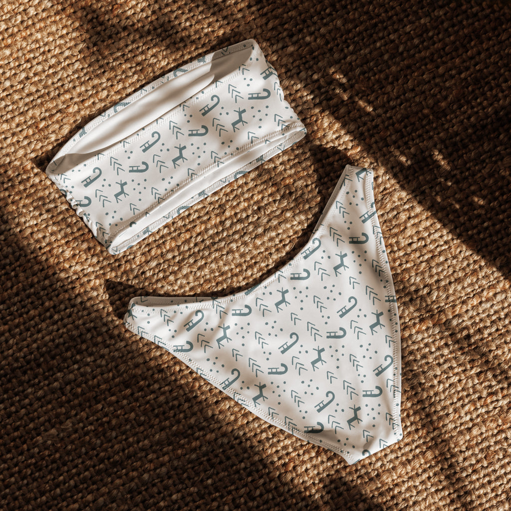 White bikini set with teal deer and arrows pattern made from quick drying recycled fabric with upf 50 plus protection