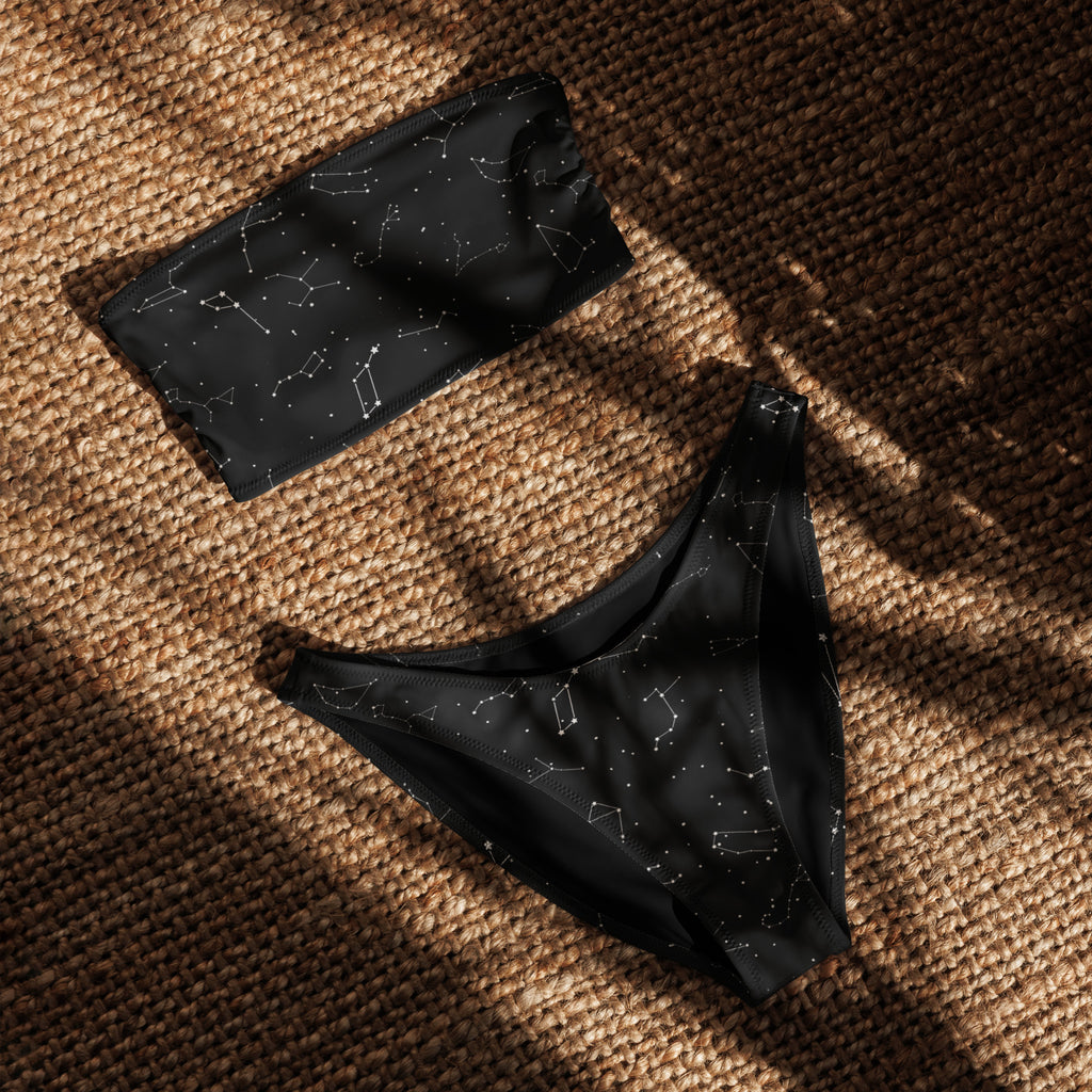 Black women’s bandeau bikini set with white celestial constellation pattern made from recycled quick drying fabric with upf 50+
