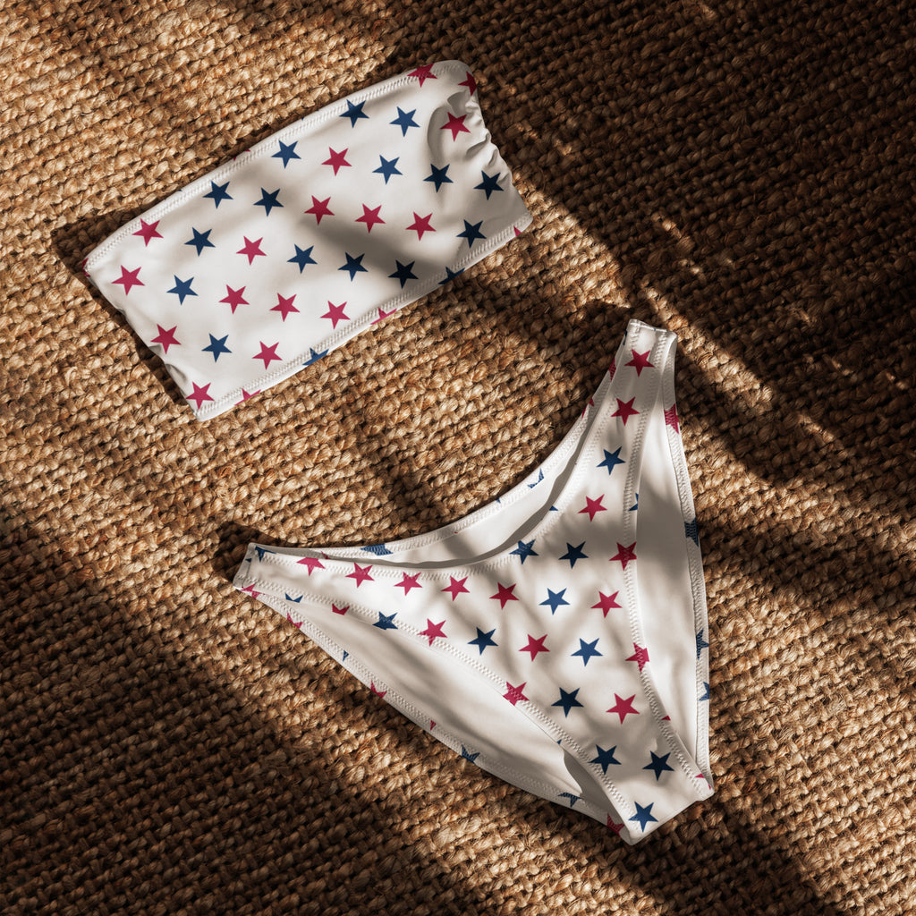 White bikini set with red and blue star patterns made from quick drying recycled fabric with upf 50 plus protection