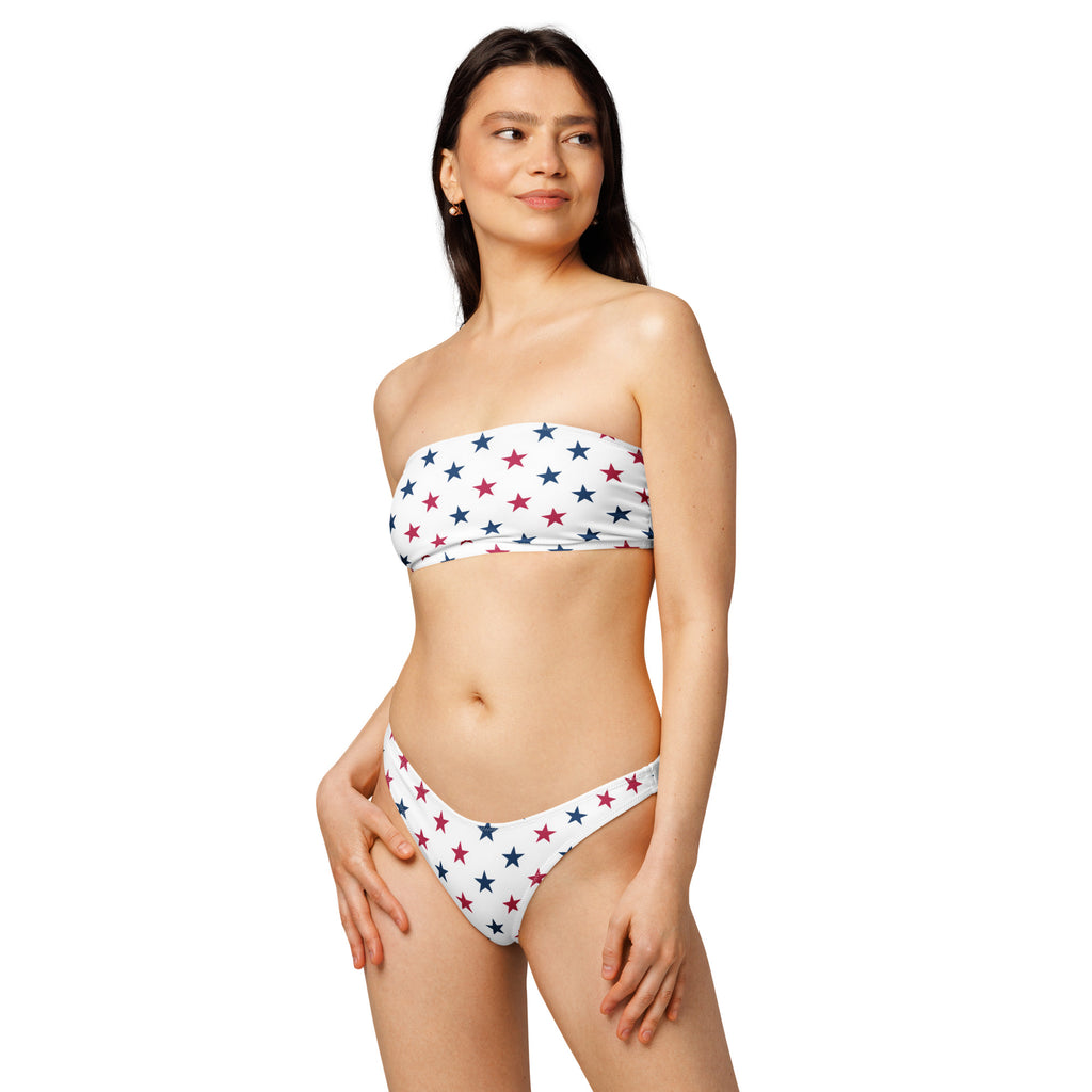 White strapless bandeau bikini set with red and navy blue stars made from quick drying recycled fabric with upf 50+