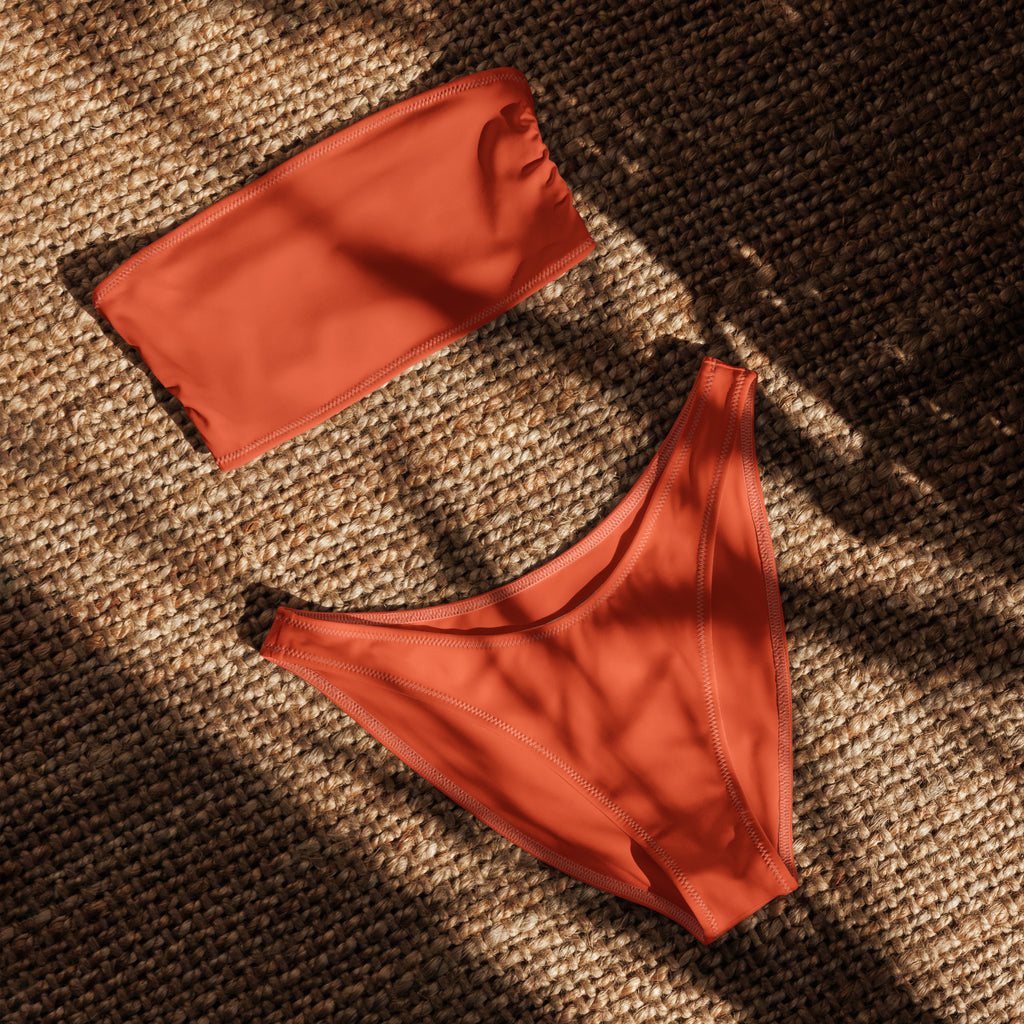 Women’s orange recycled bandeau bikini set in vibrant coral with smooth stretchy quick drying fabric and upf 50+ protection