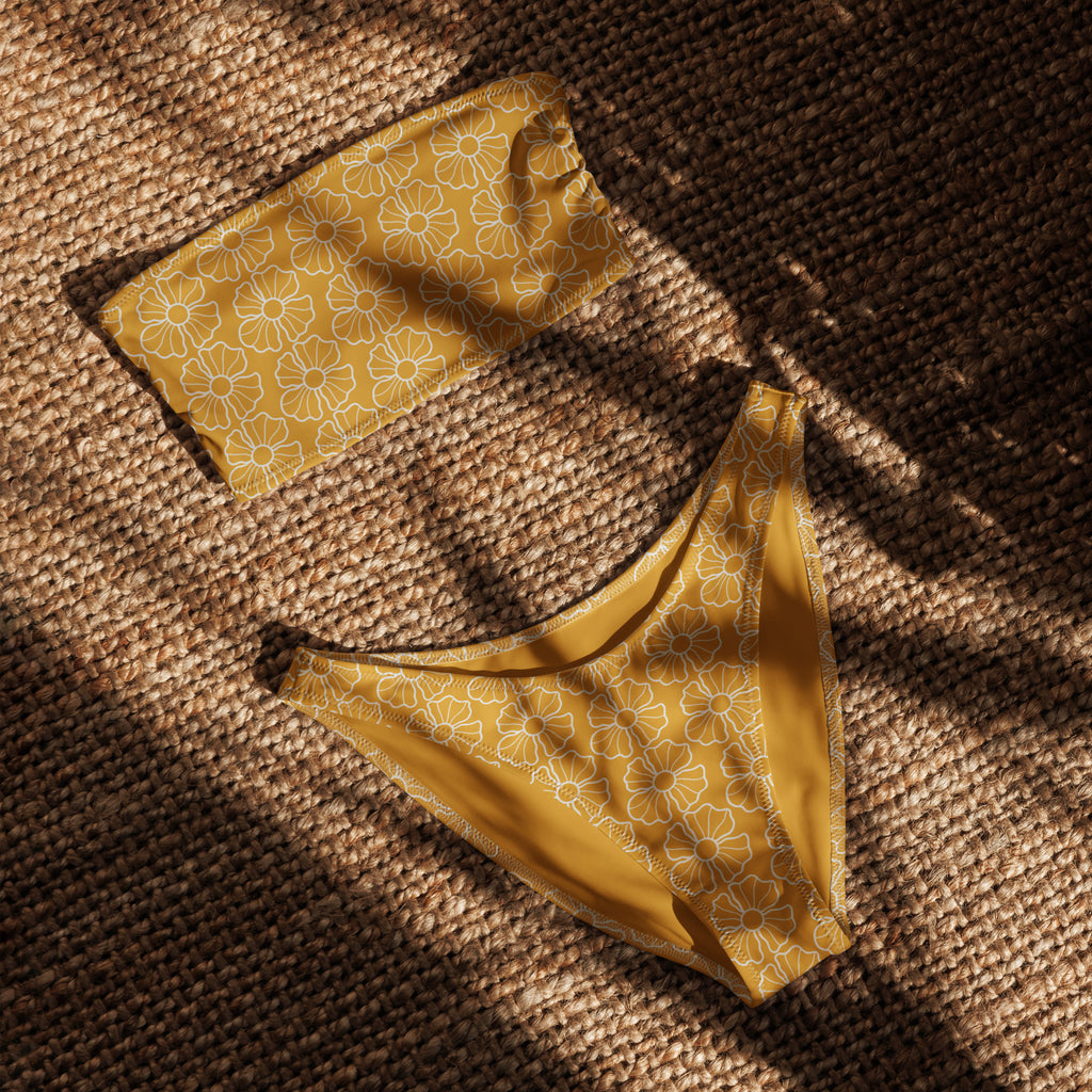 Women’s mustard yellow floral recycled bandeau bikini with delicate white daisy patterns lace trim upf 50 quick drying fabric