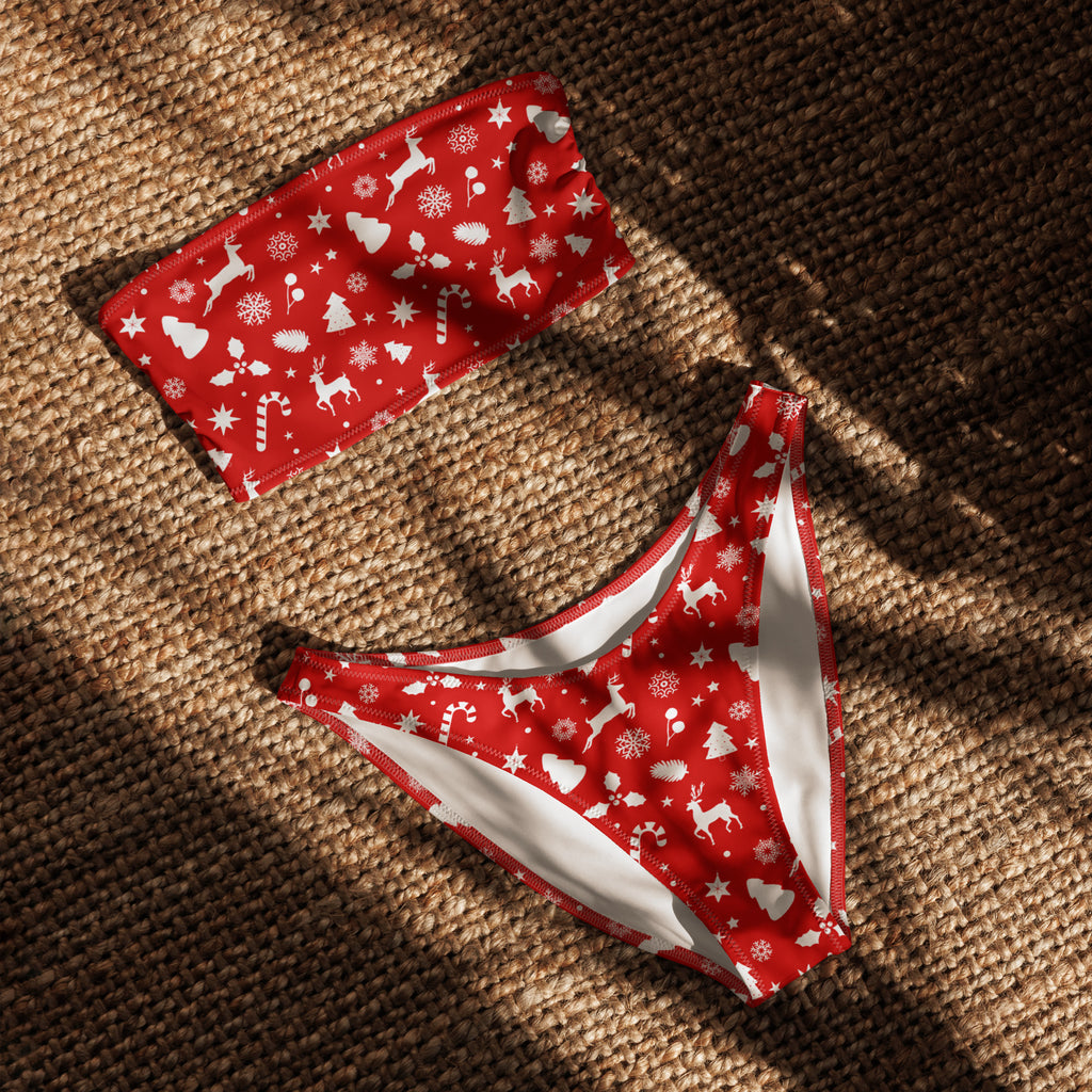 Women’s red christmas recycled bandeau bikini with white reindeer snowflakes candy canes on quick drying fabric