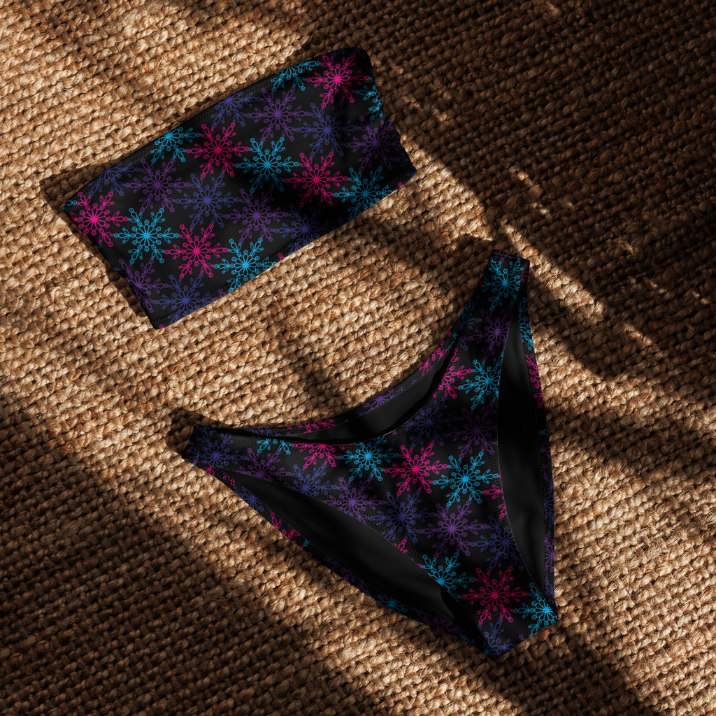 Women’s black neon snowflake recycled bandeau bikini with vibrant pink blue purple snowflakes quick drying fabric upf 50+