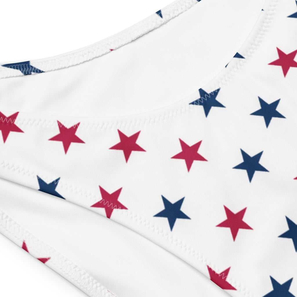 White bandeau bikini top with red and navy blue stars made from quick drying recycled fabric with upf 50 plus