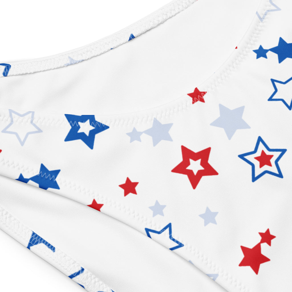 White bikini bottom with red blue and light gray star pattern made from quick drying recycled fabric with upf 50+ protection