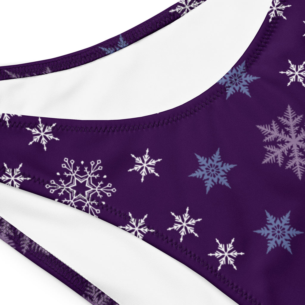 Women’s purple bandeau bikini top with white and light blue snowflake patterns made from quick drying recycled fabric