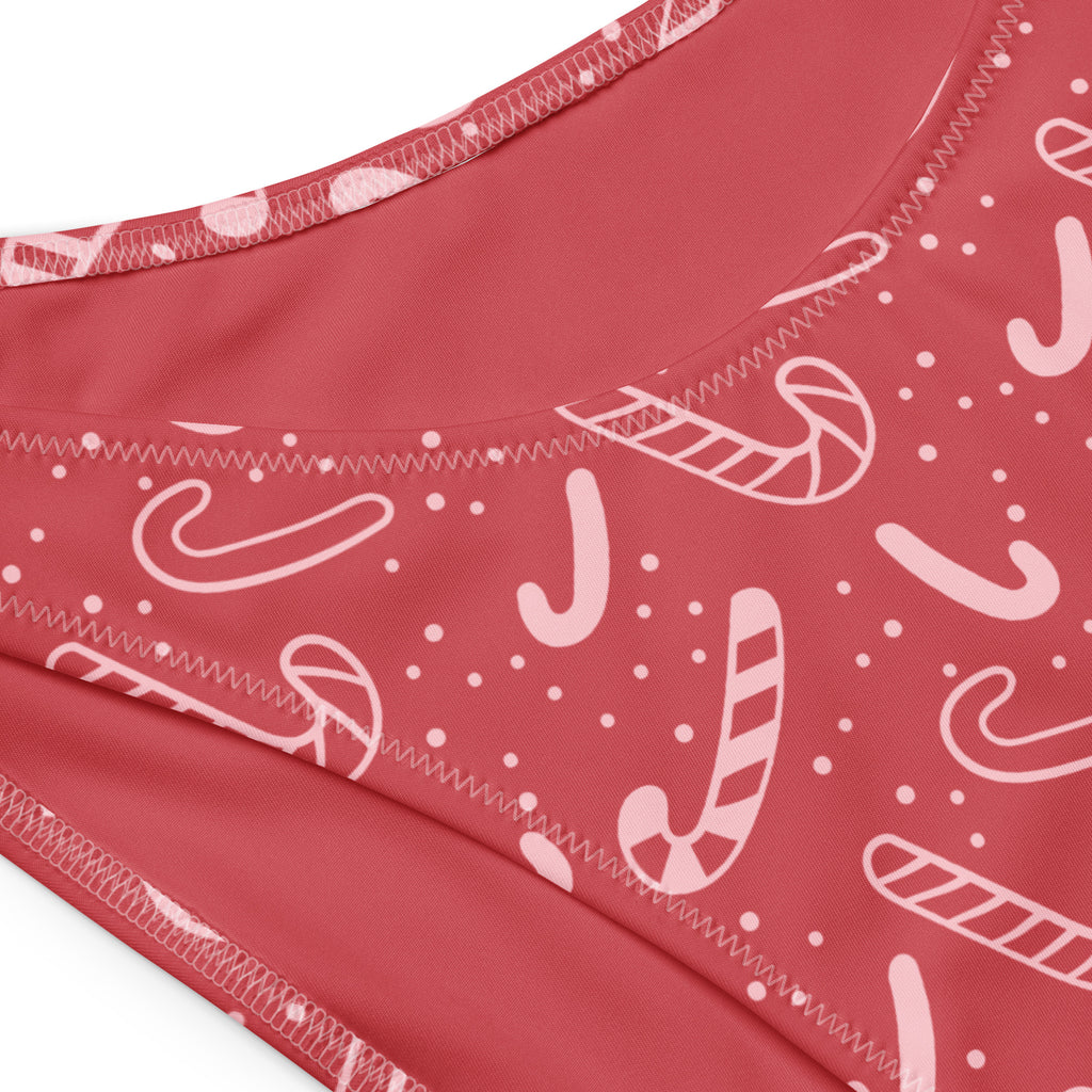Women’s red candy cane bandeau bikini top with white dot pattern made from quick drying recycled fabric with UPF 50+