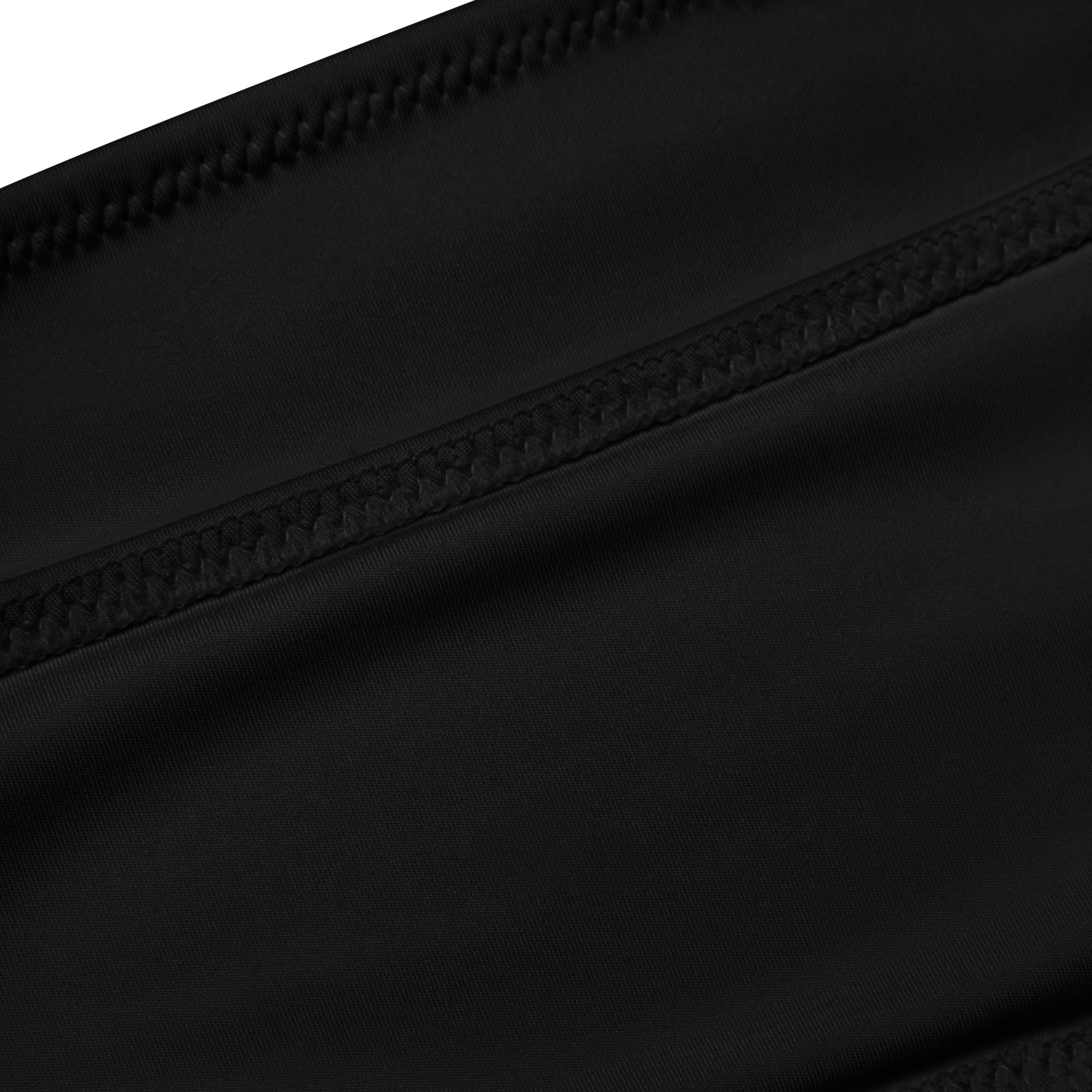 Black nylon pouch with reinforced stitching along zipper detail designed for quick drying fabric use in women’s recycled bandeau bikini