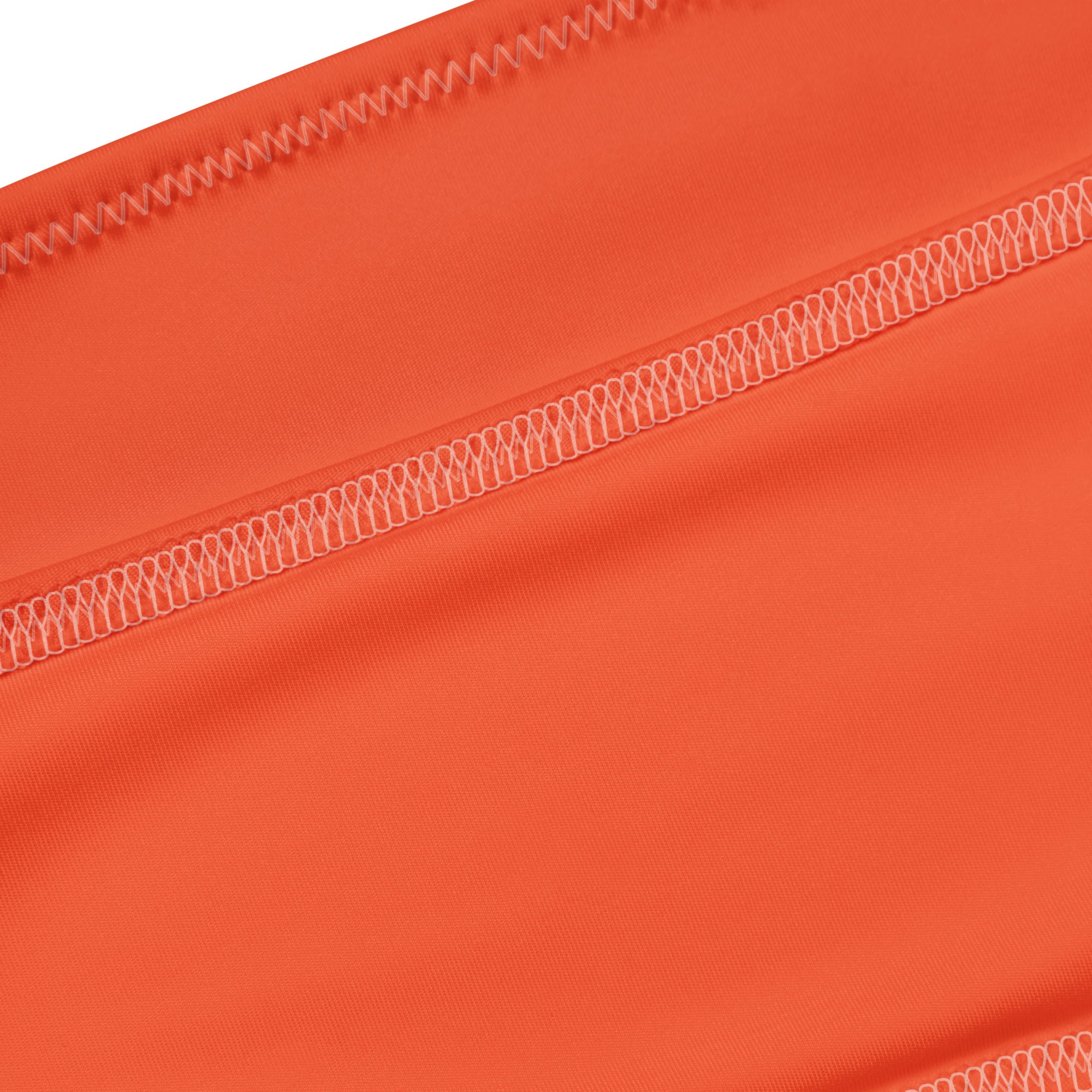 Women’s orange recycled bandeau bikini with quick drying fabric and distinctive white zigzag stitching seams