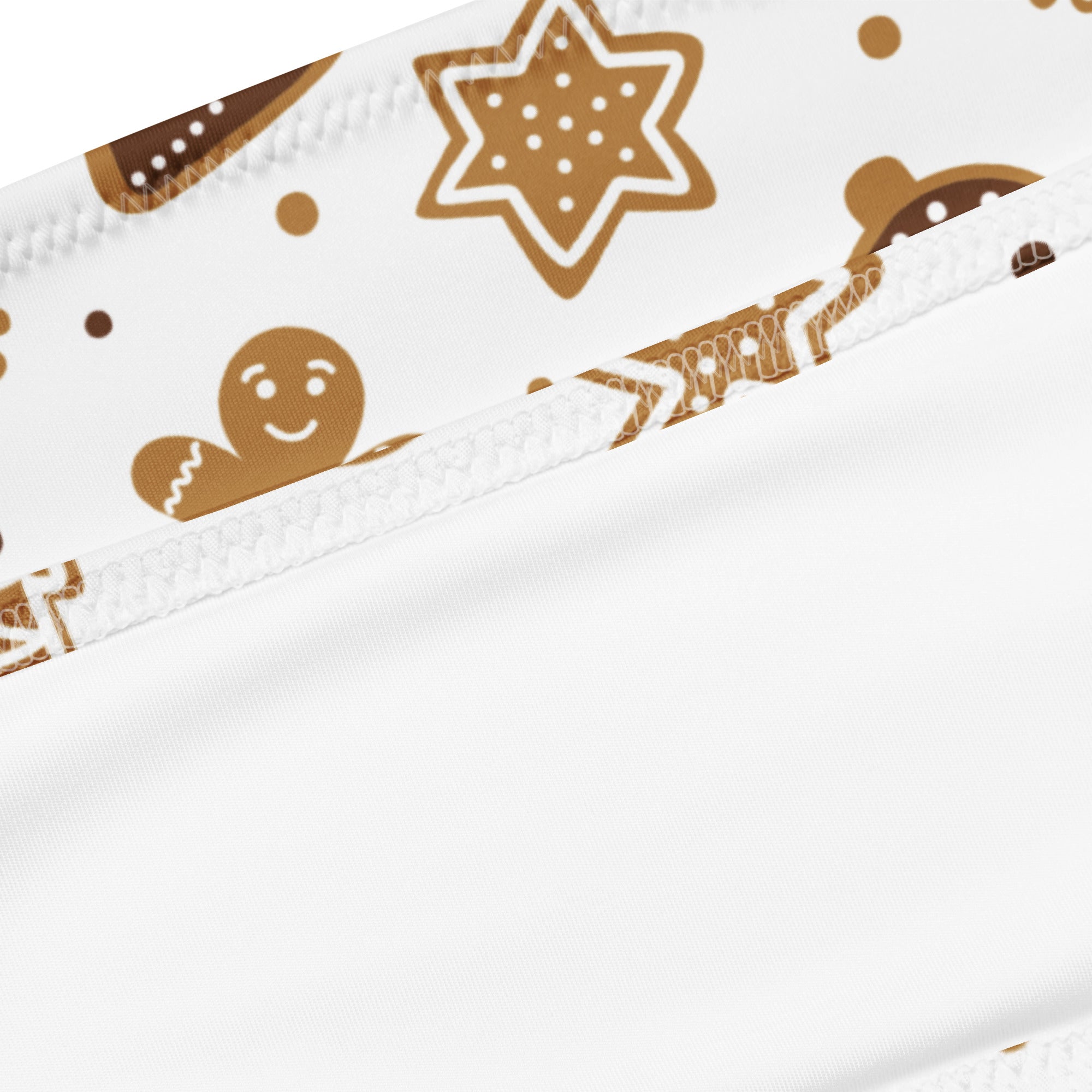 White fabric headband with festive brown gingerbread cookie pattern and white icing details for quick drying use