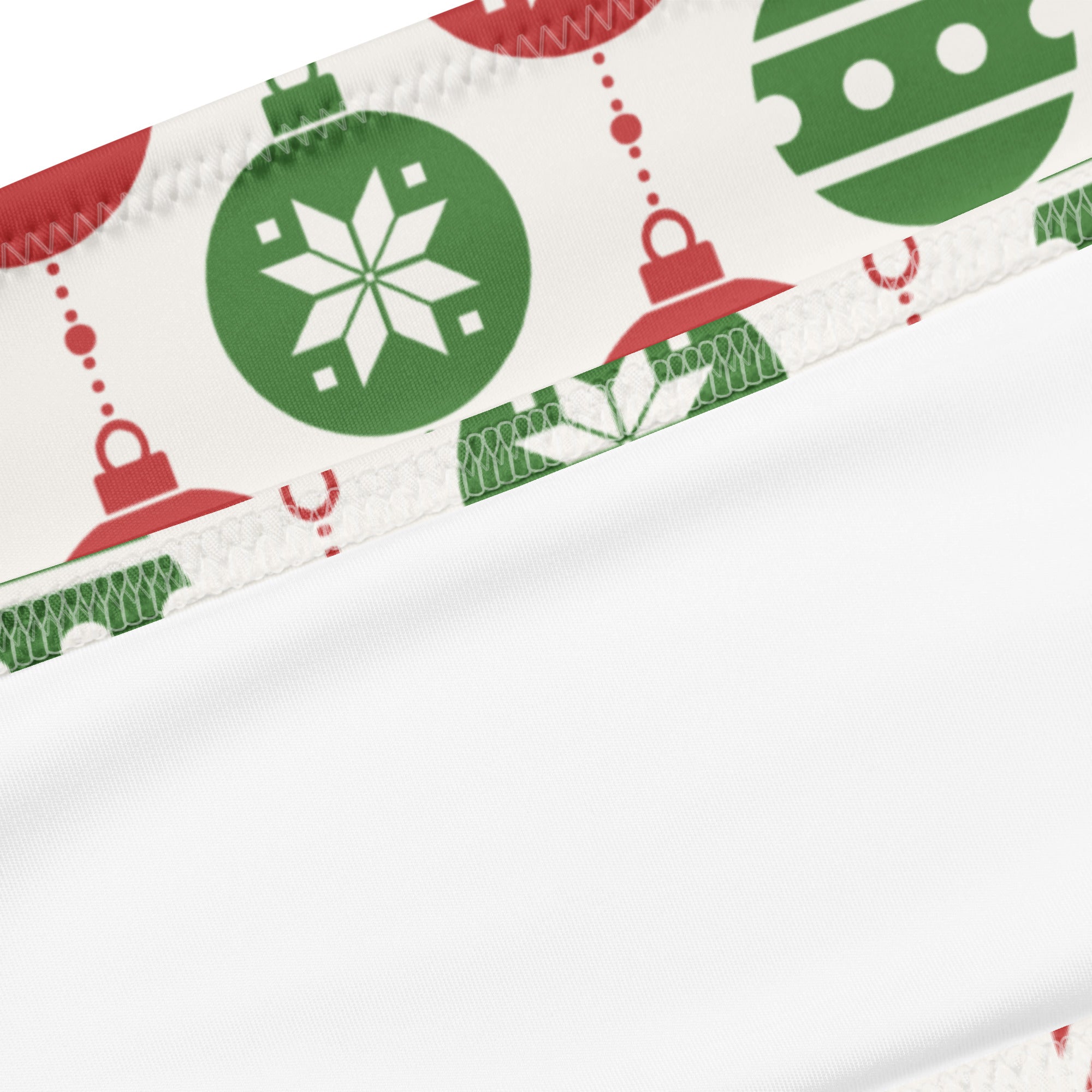 White recycled bandeau bikini with festive green and red christmas ornaments and snowflakes quick drying fabric upf 50+