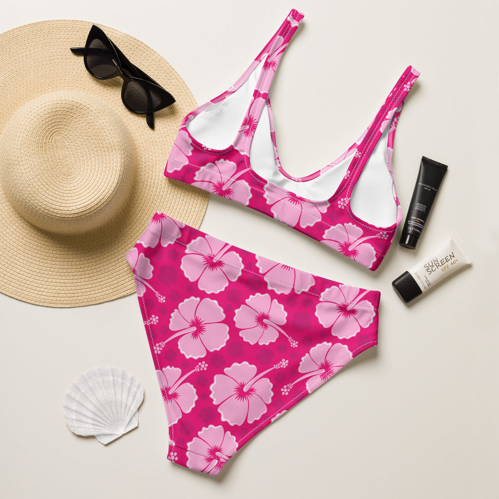 A vibrant pink women’s tropical hibiscus padded two-piece bikini in quick drying recycled fabric with upf 50+