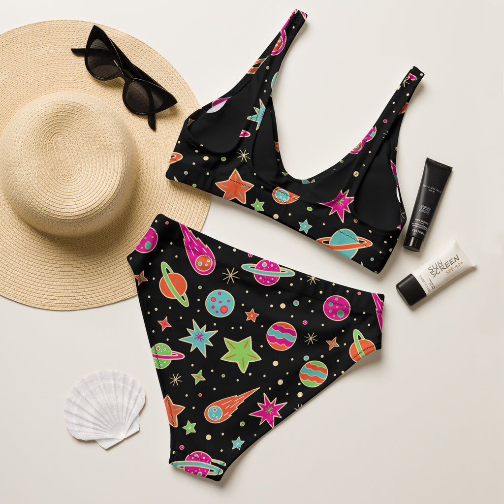 Women’s neon space print black swimsuit set with colorful planets stars comets on quick drying recycled fabric