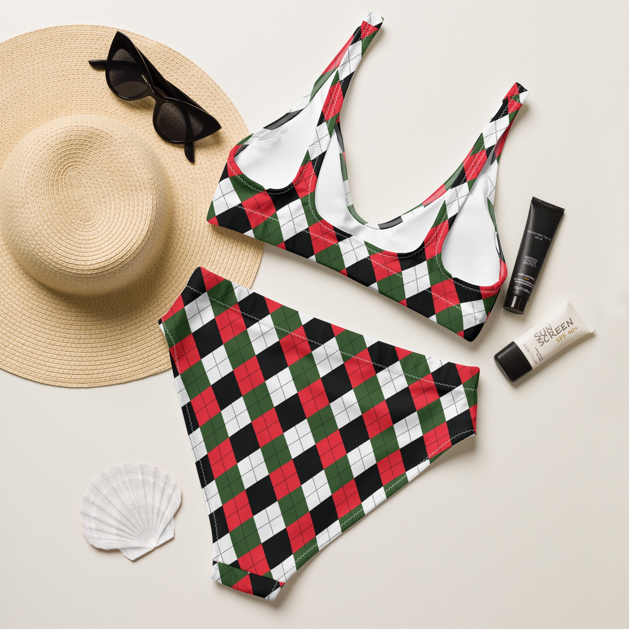 A vibrant red green and black argyle patterned women’s Christmas two-piece recycled bikini with quick drying fabric and UPF 50+