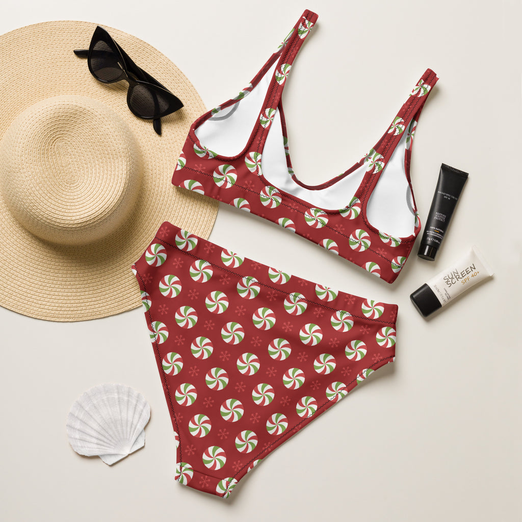 Women’s red bikini set with festive green and white peppermint swirl pattern made from quick drying recycled fabric with upf 50+