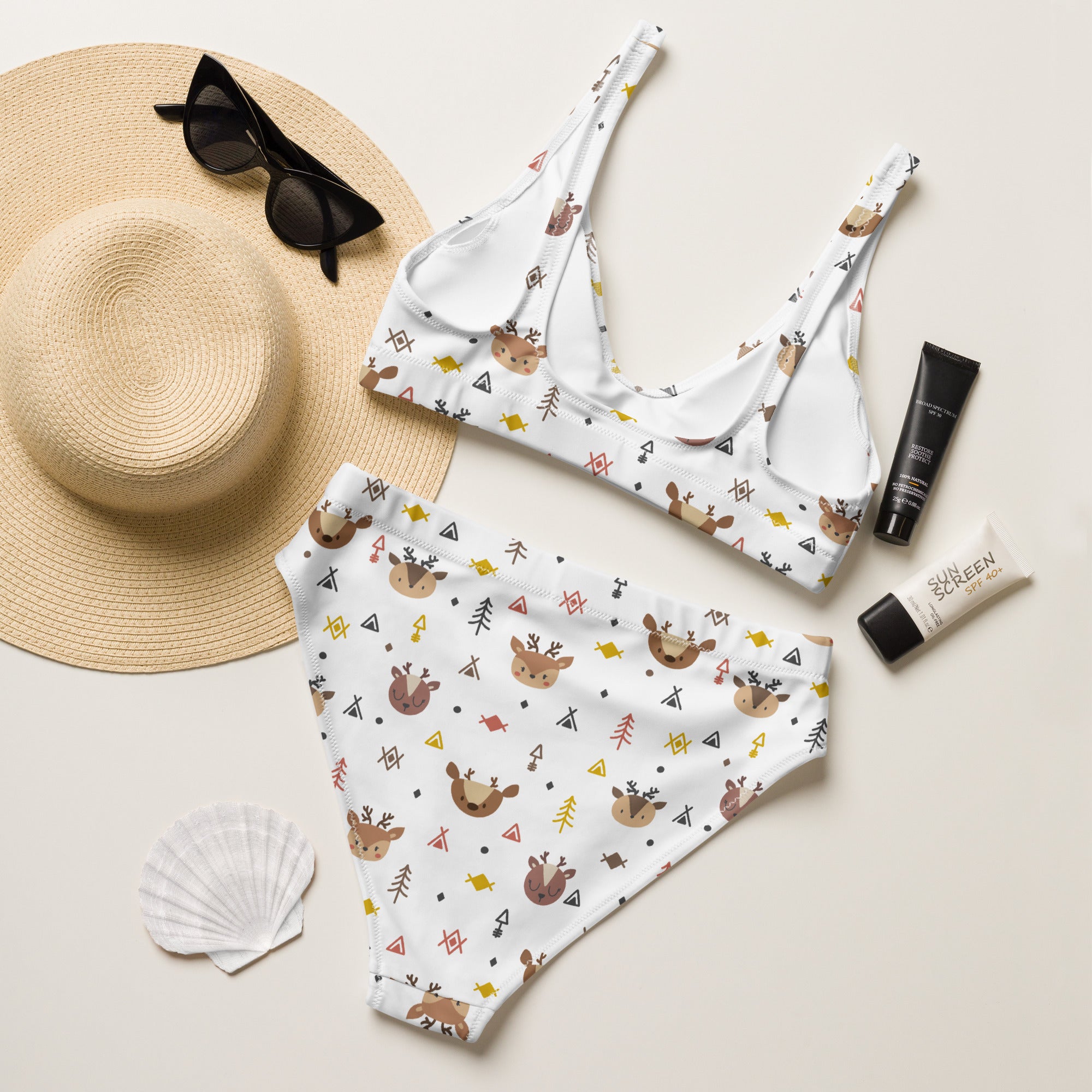 White two-piece recycled bikini with brown reindeer yellow triangles and black shapes quick drying fabric upf 50+