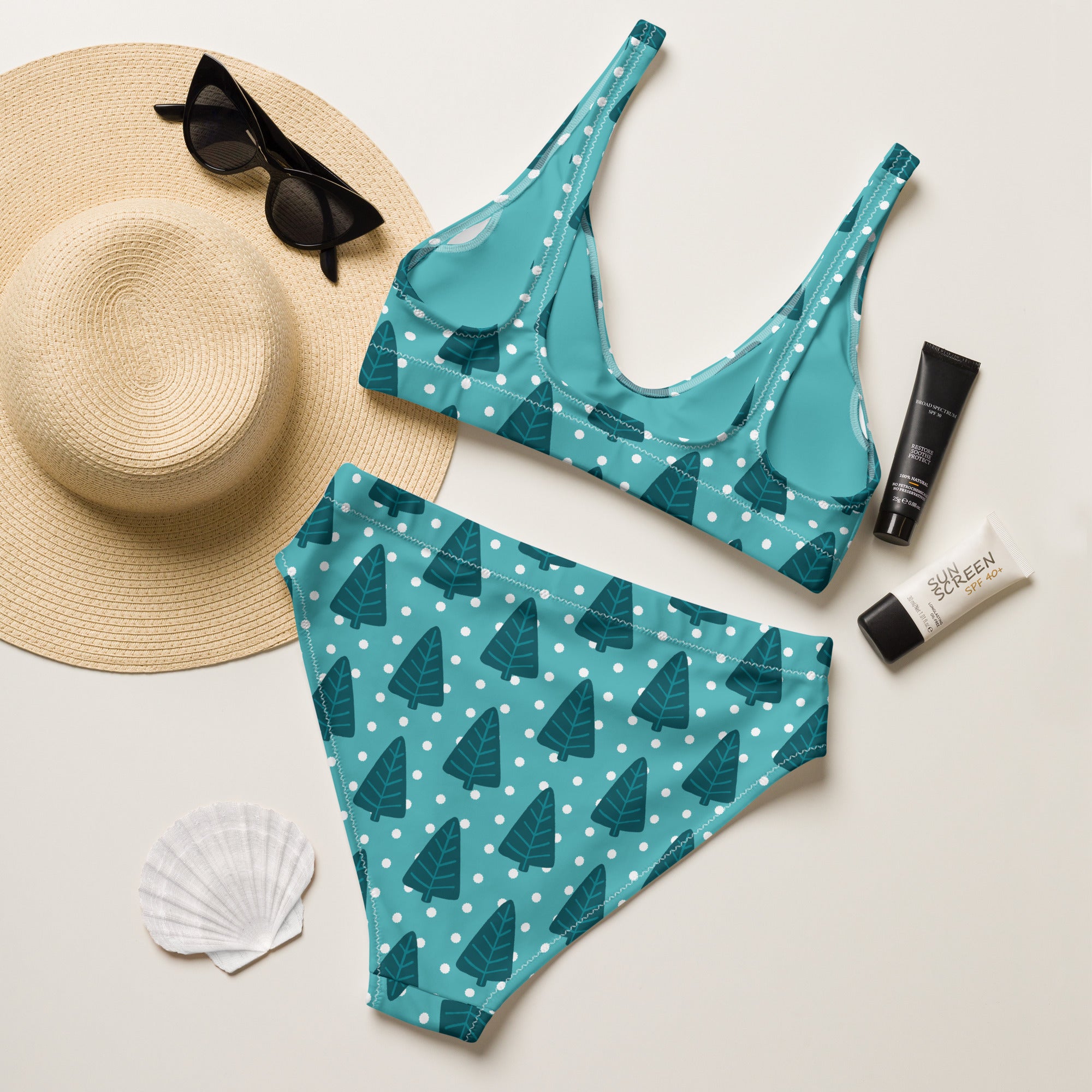 Women’s teal two-piece recycled bikini with dark green pine tree pattern and white polka dots quick drying upf 50+