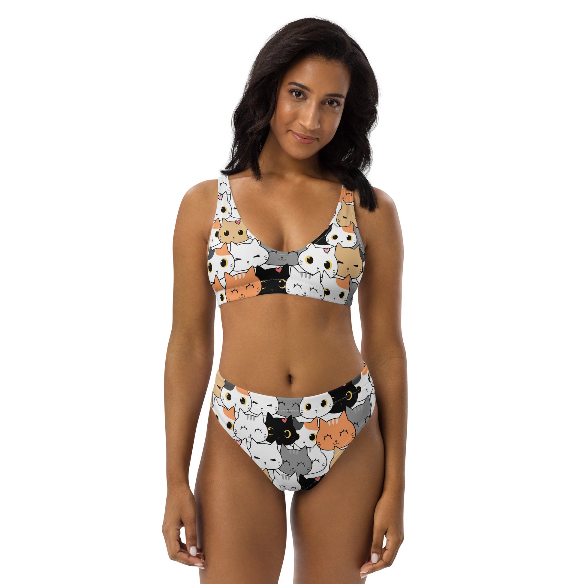 Woman wearing a bikini with a cat pattern on a white background