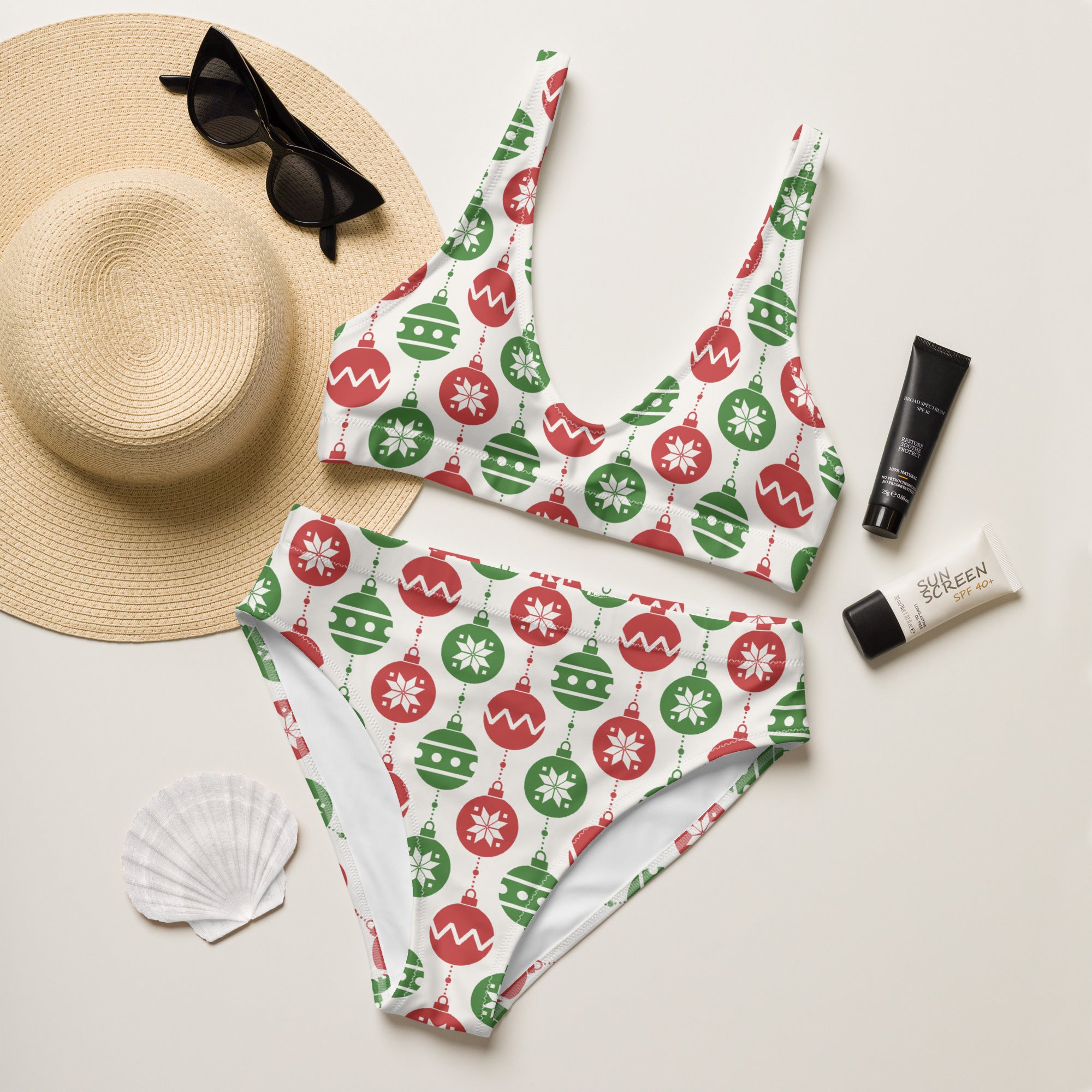 White bikini set with red and green christmas ornaments snowflakes and wavy lines made from recycled quick drying fabric with upf 50+